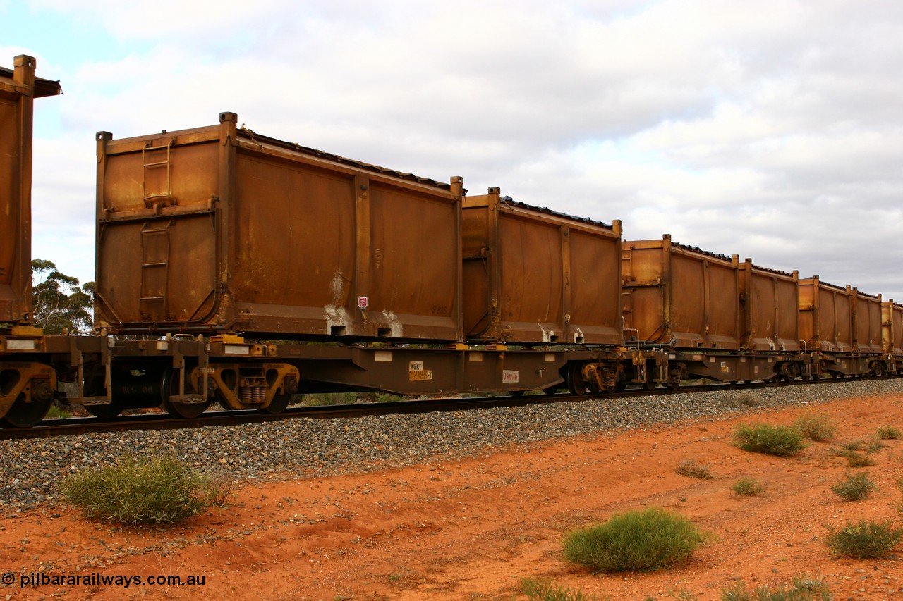 060527 4104
Scotia, AQNY 32166, one of sixty two waggons built by Goninan WA in 1998 as WQN type for Murrin Murrin container traffic, with sulphur skips S83S and S14R both with original style doors and sliding tarpaulins, train 6029 loaded Malcolm freighter.
Keywords: AQNY-type;AQNY32166;Goninan-WA;WQN-type;