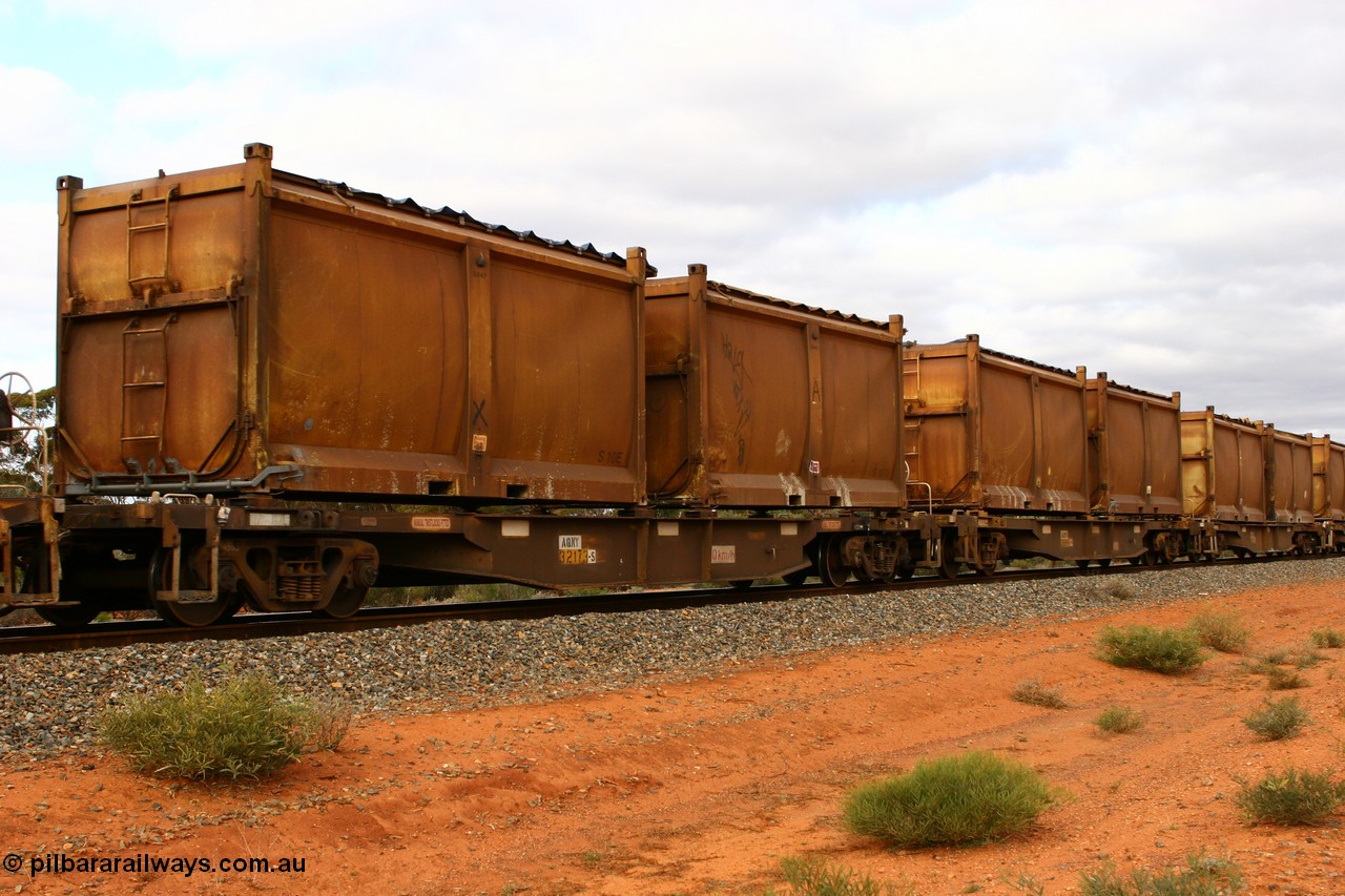 060527 4105
Scotia, AQNY 32173, one of sixty two waggons built by Goninan WA in 1998 as WQN type for Murrin Murrin container traffic, with sulphur skips S10E and S107U both with original style doors and sliding tarpaulins, train 6029 loaded Malcolm freighter.
Keywords: AQNY-type;AQNY32173;Goninan-WA;WQN-type;