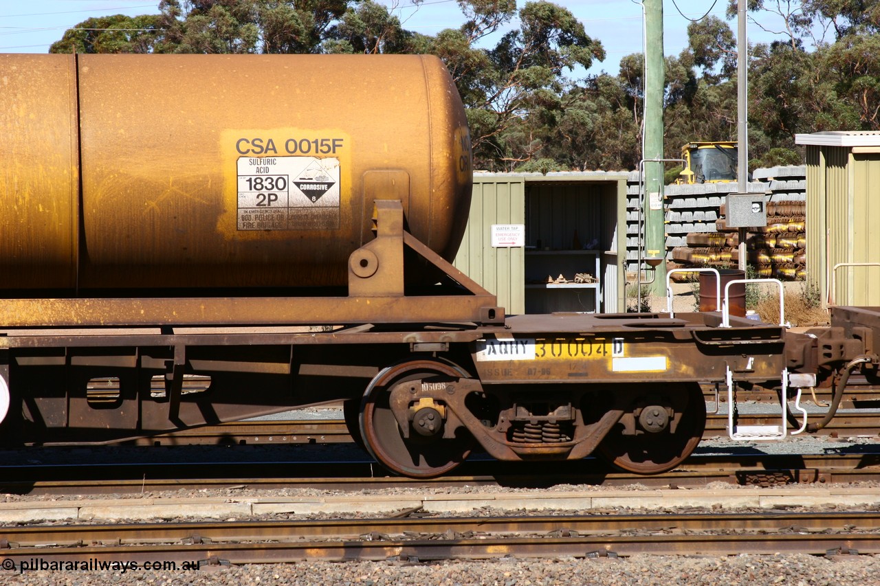 060528 4416
West Kalgoorlie, AQHY 30004 with sulphuric acid tank CSA 0015, originally built by the WAGR Midland Workshops in 1964/66 as a WF type flat waggon, then in 1997, following several recodes and modifications, was the lowest of seventy five waggons converted to the WQH type to carry CSA sulphuric acid tanks between Hampton/Kalgoorlie and Perth/Kwinana.
Keywords: AQHY-type;AQHY30004;WAGR-Midland-WS;WF-type;WFDY-type;WFDF-type;RFDF-type;WQH-type;
