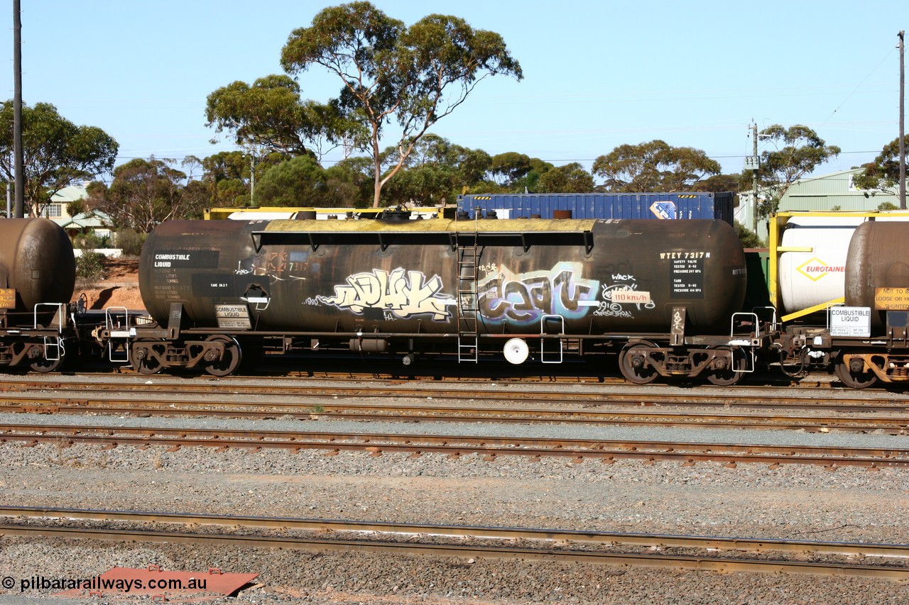 060528 4512 WTEY7317N
West Kalgoorlie, WTEY 7317 diesel fuel tank waggon, former NTAF in service for BP Oil, former AMPOL tank, coded WTEY when arrived in WA.
Keywords: WTEY-type;WTEY7317;NTAF-type;