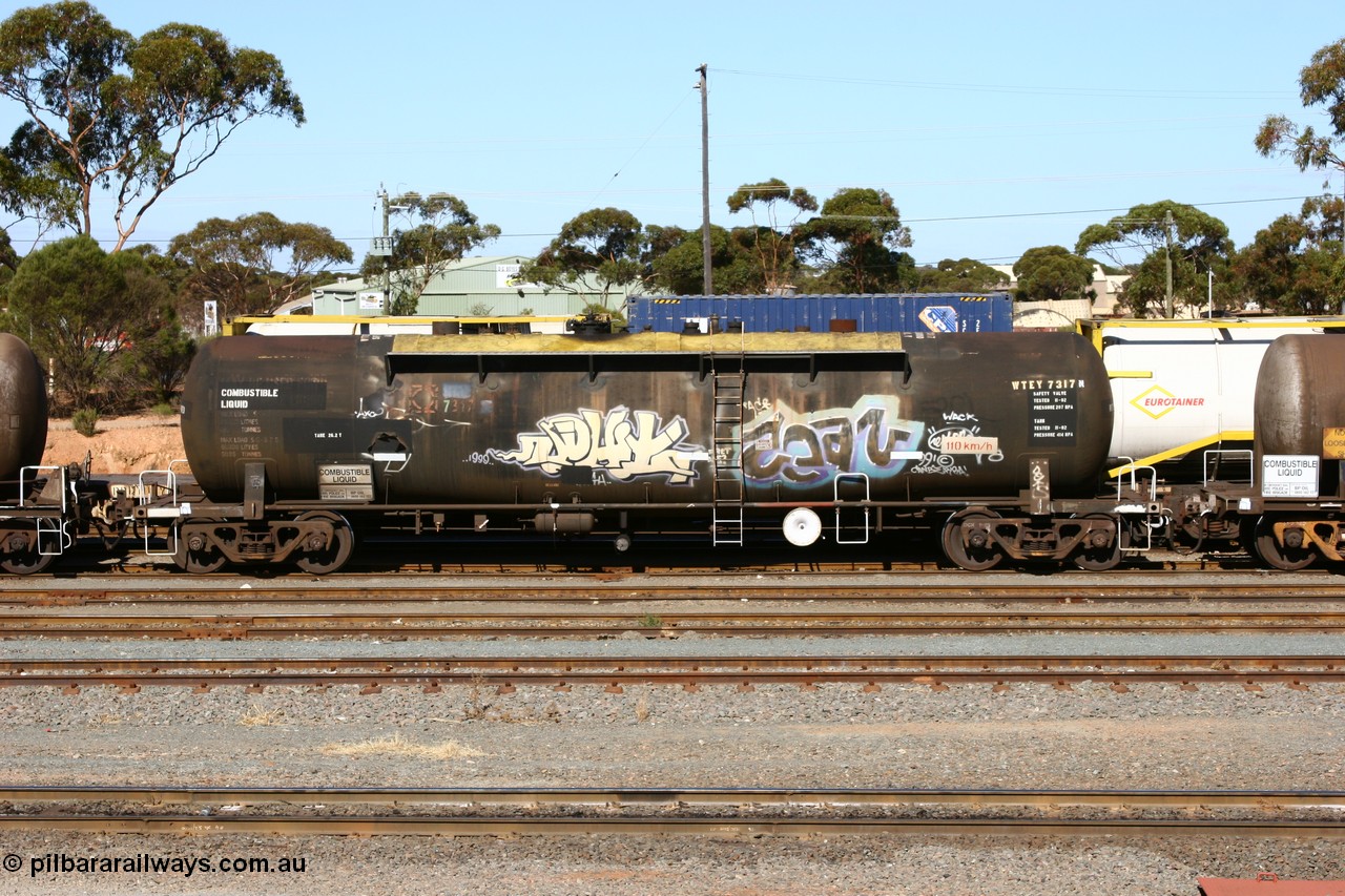 060528 4514
West Kalgoorlie, WTEY 7317 diesel fuel tank waggon, former NTAF in service for BP Oil, former AMPOL tank, coded WTEY when arrived in WA.
Keywords: WTEY-type;WTEY7317;NTAF-type;