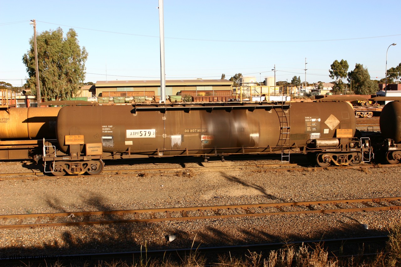 060528 4634 ATPF579J
West Kalgoorlie, ATPF 579 fuel tank waggon built by WAGR Midland Workshops 1974 for Shell as WJP type 80.66 kL one compartment one dome, fitted with type F InterLock couplers.
Keywords: ATPF-type;ATPF579;WAGR-Midland-WS;WJP-type;