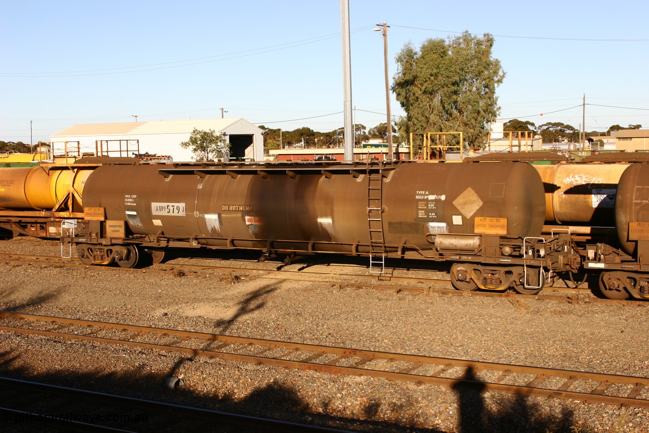 060528 4635
West Kalgoorlie, ATPF 579 fuel tank waggon built by WAGR Midland Workshops 1974 for Shell as WJP type 80.66 kL one compartment one dome, fitted with type F InterLock couplers.
Keywords: ATPF-type;ATPF579;WAGR-Midland-WS;WJP-type;