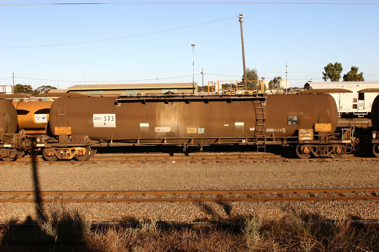 060528 4637 ATPF573B
West Kalgoorlie, ATPF 573 fuel tank waggon built by WAGR Midland Workshops 1974 for Shell as WJP type 80.66 kL one compartment one dome, capacity of 80500 litres, Shell Fleet No. 708.
Keywords: ATPF-type;ATPF573;WAGR-Midland-WS;WJP-type;