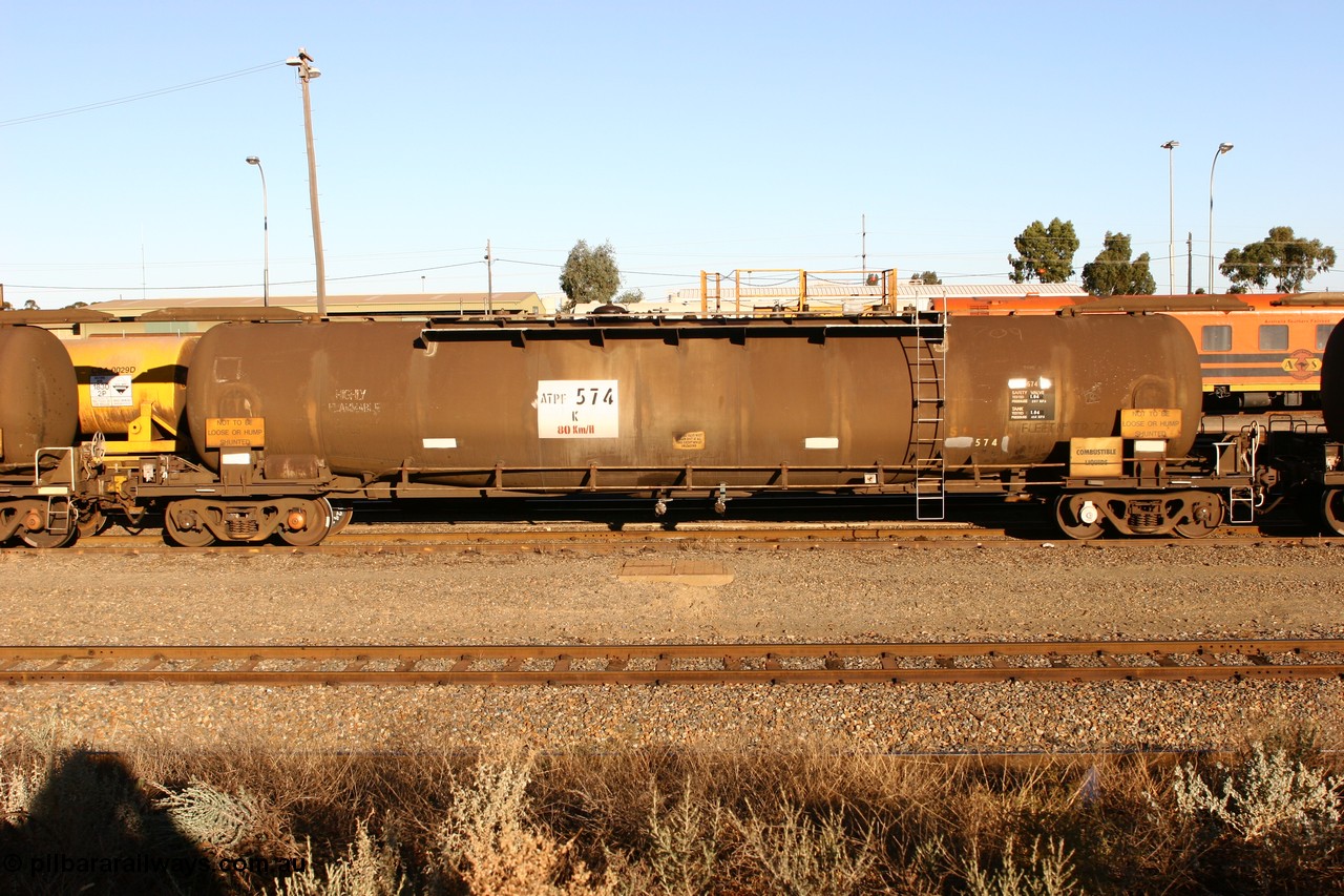 060528 4638 ATPF574K
West Kalgoorlie, ATPF 574 fuel tanker, one of nine built by WAGR Midland Workshops in 1974 for Shell as type WJP, 80.66 kL one compartment one dome, original code and fleet no. TR709, with a capacity now of 80000 litres.
Keywords: ATPF-type;ATPF574;WAGR-Midland-WS;WJP-type;