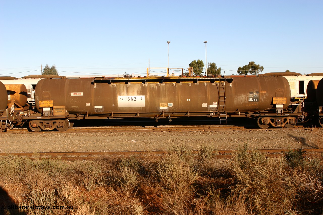 060528 4639 ATLF562S
West Kalgoorlie, ATLF 562 tank waggon, built by WAGR Midland Workshops 1973 for Shell as type WJL 86.49 kL one compartment one dome with a capacity of 80500 litres, fitted with type F InterLock couplers.
Keywords: ATLF-type;ATLF562;WAGR-Midland-WS;WJL-type;