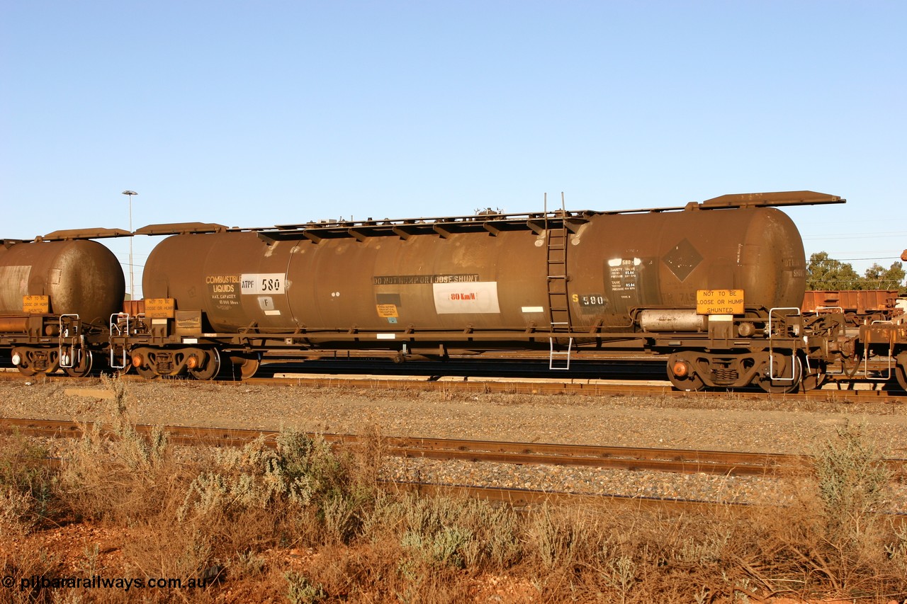 060528 4650 ATPF580F
West Kalgoorlie, ATPF 580 fuel tank waggon built by WAGR Midland Workshops 1976 for Shell as type WJP, 80.66 kL one compartment one dome, capacity of 80500 litres, it also spent time in SA in 1985, fitted with type F InterLock couplers, Shell Fleet no. TR715 still visible.
Keywords: ATPF-type;ATPF580;WAGR-Midland-WS;WJP-type;