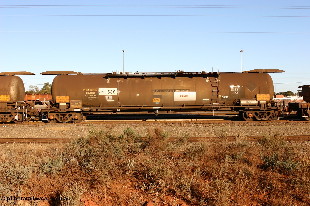 060528 4652
West Kalgoorlie, ATPF 580 fuel tank waggon built by WAGR Midland Workshops 1976 for Shell as type WJP, 80.66 kL one compartment one dome, capacity of 80500 litres, it also spent time in SA in 1985, fitted with type F InterLock couplers, Shell Fleet no. TR715 still visible.
Keywords: ATPF-type;ATPF580;WAGR-Midland-WS;WJP-type;