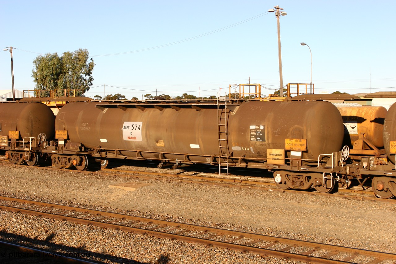060528 4661
West Kalgoorlie, ATPF 574 fuel tanker, one of nine built by WAGR Midland Workshops in 1974 for Shell as type WJP, 80.66 kL one compartment one dome, original code and fleet no. TR709, with a capacity now of 80000 litres.
Keywords: ATPF-type;ATPF574;WAGR-Midland-WS;WJP-type;