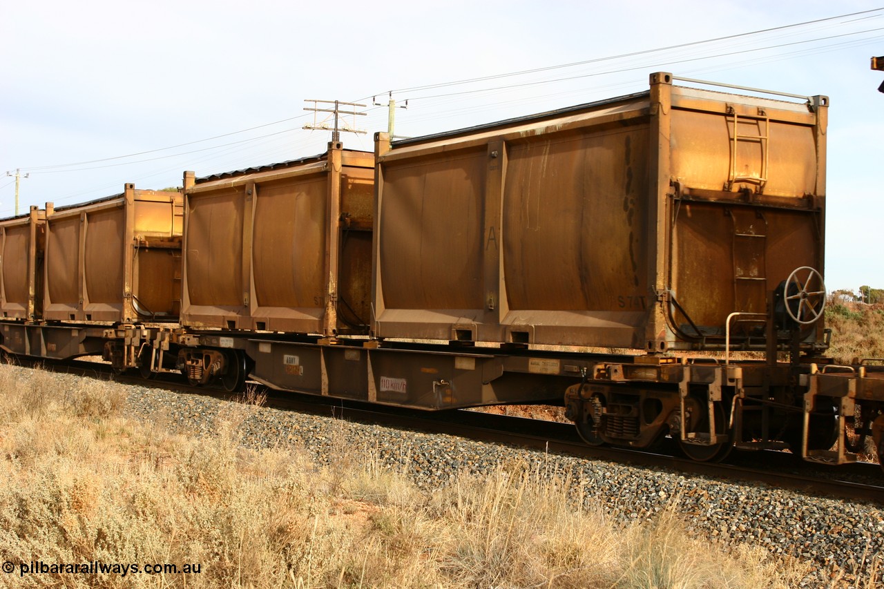 060531 4988
West Kalgoorlie, AQNY 32189 one of sixty two waggons built by Goninan WA in 1998 as WQN type for Murrin Murrin container traffic, with sulphur skips S74 and S7 with original door and sliding tarpaulins.
Keywords: AQNY-type;AQNY32189;Goninan-WA;WQN-type;