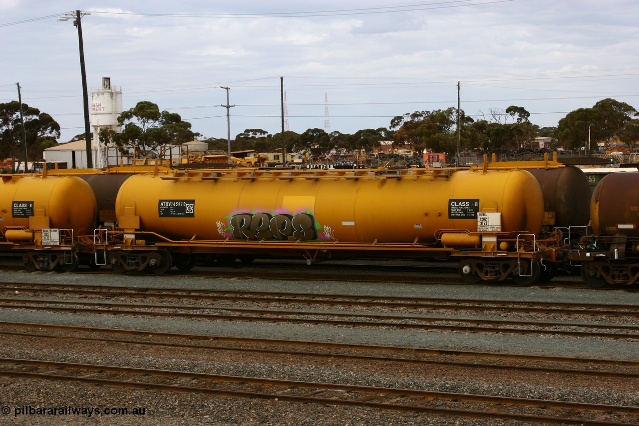 070526 9053
West Kalgoorlie, ATBY 14591 fuel tank waggon built by Westrail Midland Workshops in a batch of nine in 1981 for Bain Leasing Pty Ltd as type JPB, 82,000 litres but 14591 was issued to standard gauge as WJPB type, in 1985 it was converted to narrow gauge as JPBA type.
Keywords: ATBY-type;ATBY14591;Westrail-Midland-WS;WJPB-type;JPBA-type;