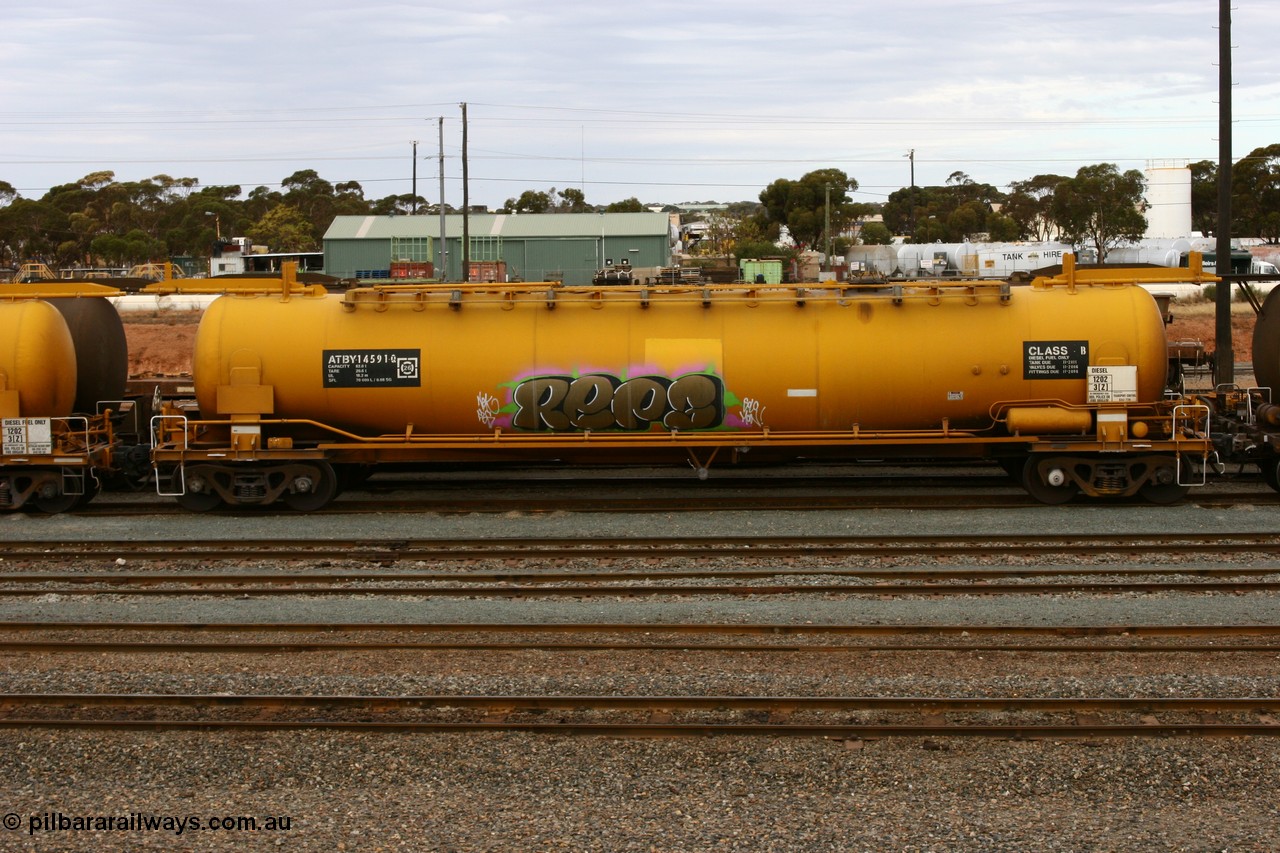 070526 9054
West Kalgoorlie, ATBY 14591 fuel tank waggon built by Westrail Midland Workshops in a batch of nine in 1981 for Bain Leasing Pty Ltd as type JPB, 82,000 litres but 14591 was issued to standard gauge as WJPB type, in 1985 it was converted to narrow gauge as JPBA type.
Keywords: ATBY-type;ATBY14591;Westrail-Midland-WS;WJPB-type;JPBA-type;