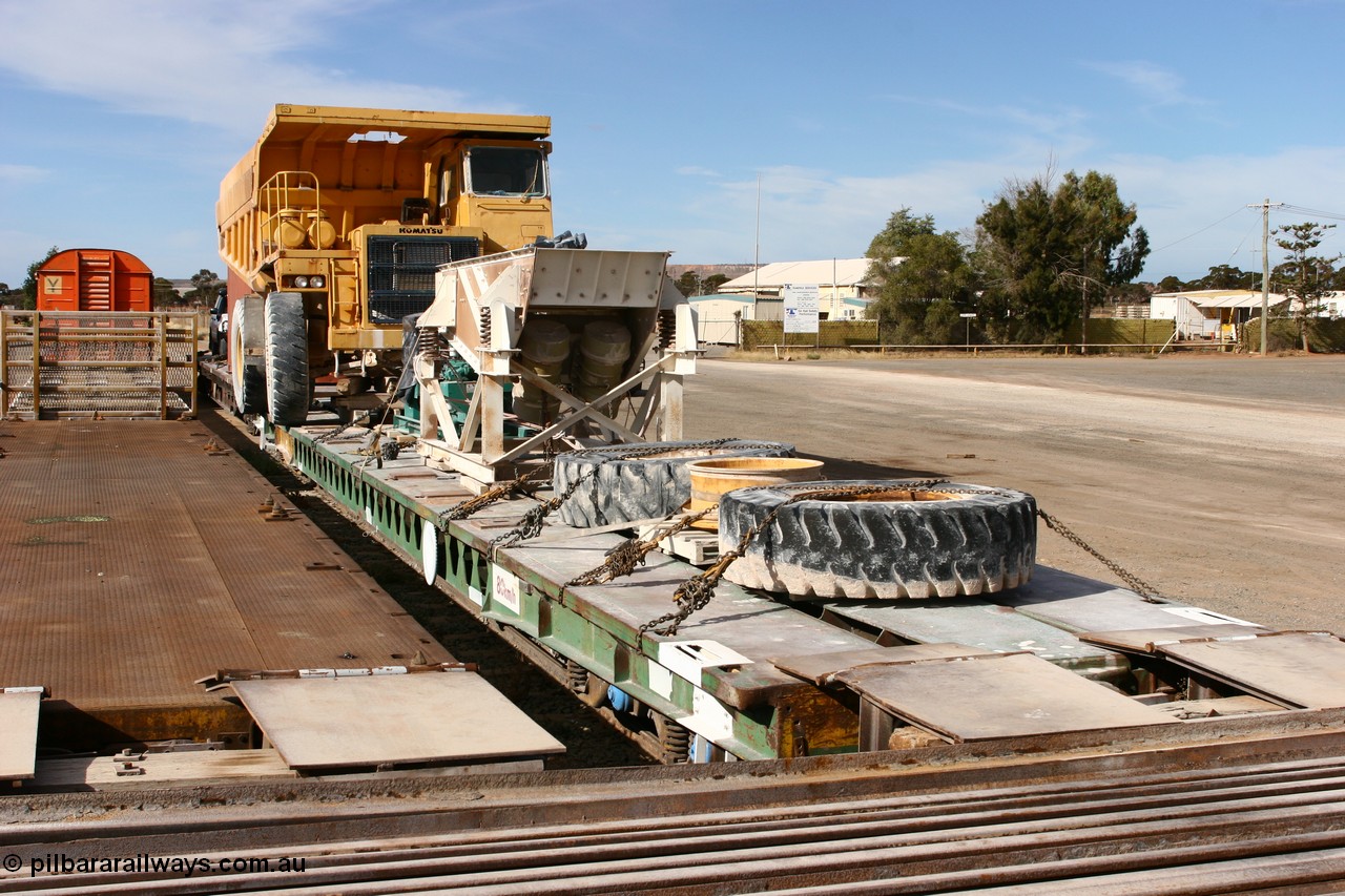 070527 9174
Parkeston, AZQF 1966 heavy weight waggon, originally built by Commonwealth Railways Port Augusta Workshops in November 1966, issued as 1966, coded Q, then later to AZQF, fitted with narrow gauge rails on deck for conveyance of rollingstock between Port Augusta and Marree. Seen here in use with ARG loaded with Loongana Limestone equipment. 
Keywords: AZQF-type;AZQF1966;CR-Port-Augusta-WS;Q-type;