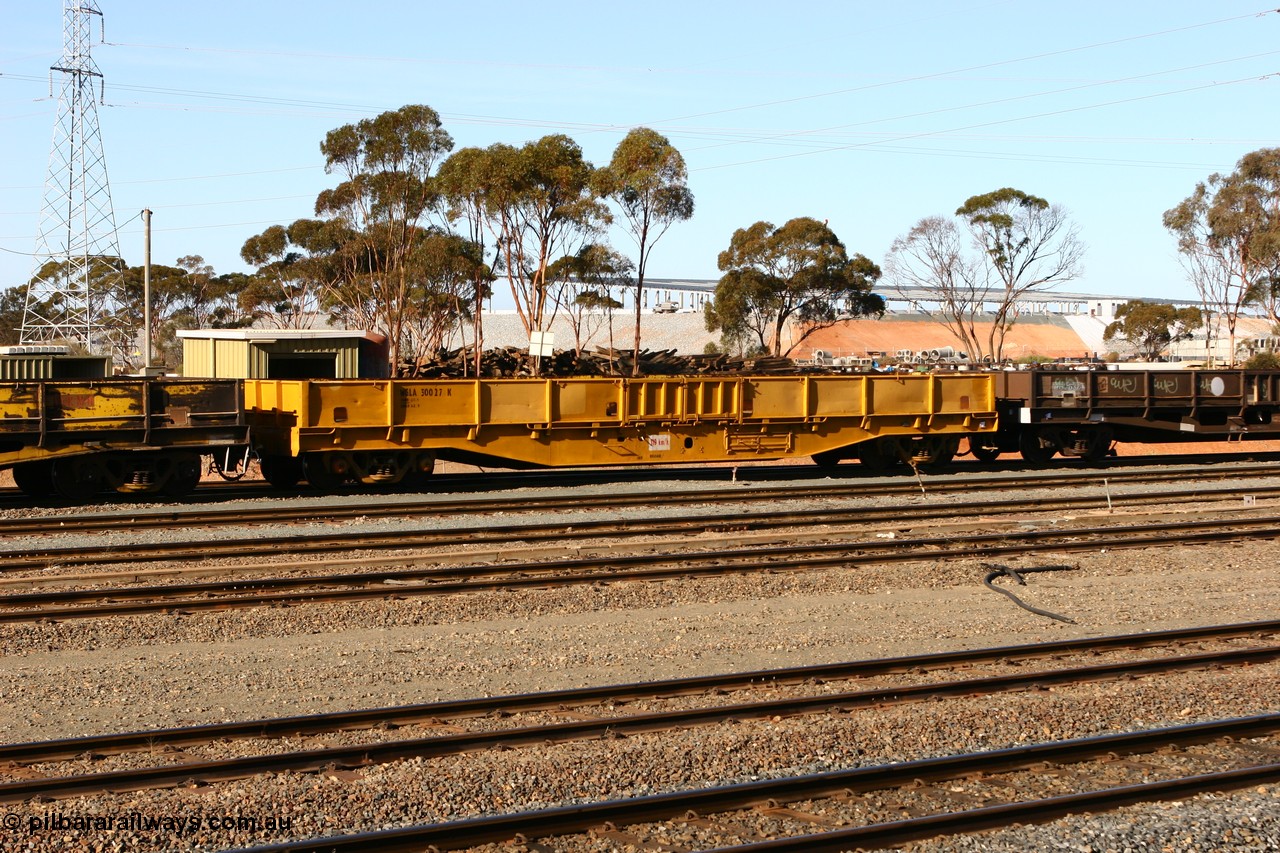 070529 9326
West Kalgoorlie, WGLA 30027 originally built by WAGR Midland Workshops in 1965 as WF type bogie flat waggon, to WFW in 1974, then converted to bagged nickel matte traffic WGLA type in 1984.
Keywords: WGLA-type;WGLA30027;WAGR-Midland-WS;WF-type;WFW-type;WFDY-type;