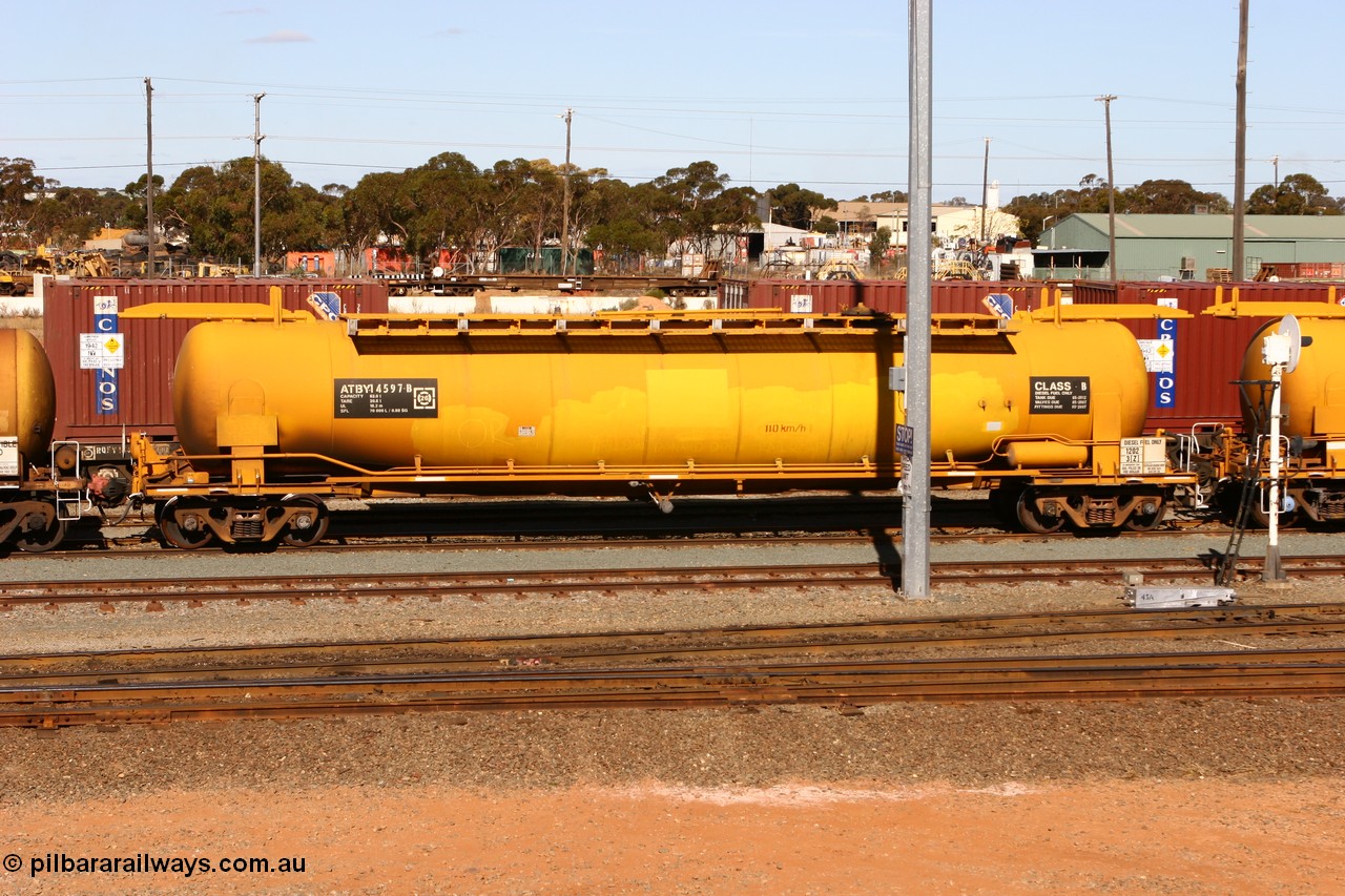 070529 9409
West Kalgoorlie, ATBY 14597 fuel tank waggon built by Westrail Midland Workshops in a batch of nine in 1981 for Bain Leasing Pty Ltd as type JPB, 82,000 litres but 14591 was issued to standard gauge as WJPB type, in 1986 it was converted to narrow gauge as JPBA type.
Keywords: ATBY-type;ATBY14597;Westrail-Midland-WS;WJPB-type;JPBA-type;