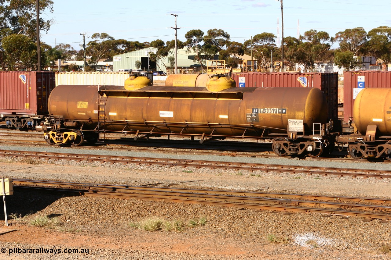 070529 9412
West Kalgoorlie, ATTY 30671 fuel tanker, class leader of five built by AE Goodwin NSW in 1970 as WST class, recoded to WSTY and then ATTY. 78600 litre capacity.
Keywords: ATTY-type;ATTY30671;AE-Goodwin;WST-type;WSTY-type;