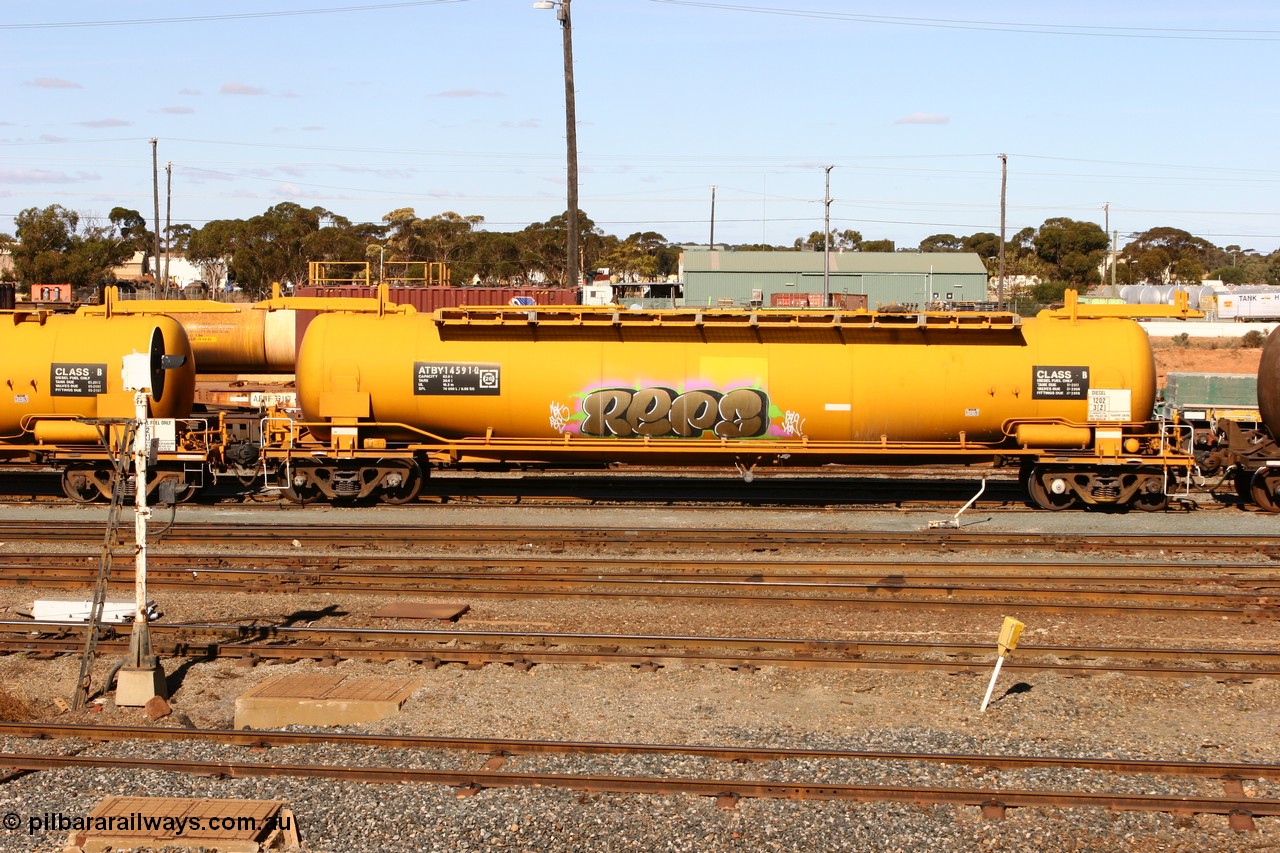 070529 9413
West Kalgoorlie, ATBY 14591 fuel tank waggon built by Westrail Midland Workshops in a batch of nine in 1981 for Bain Leasing Pty Ltd as type JPB, 82,000 litres but 14591 was issued to standard gauge as WJPB type, in 1985 it was converted to narrow gauge as JPBA type.
Keywords: ATBY-type;ATBY14591;Westrail-Midland-WS;WJPB-type;JPBA-type;