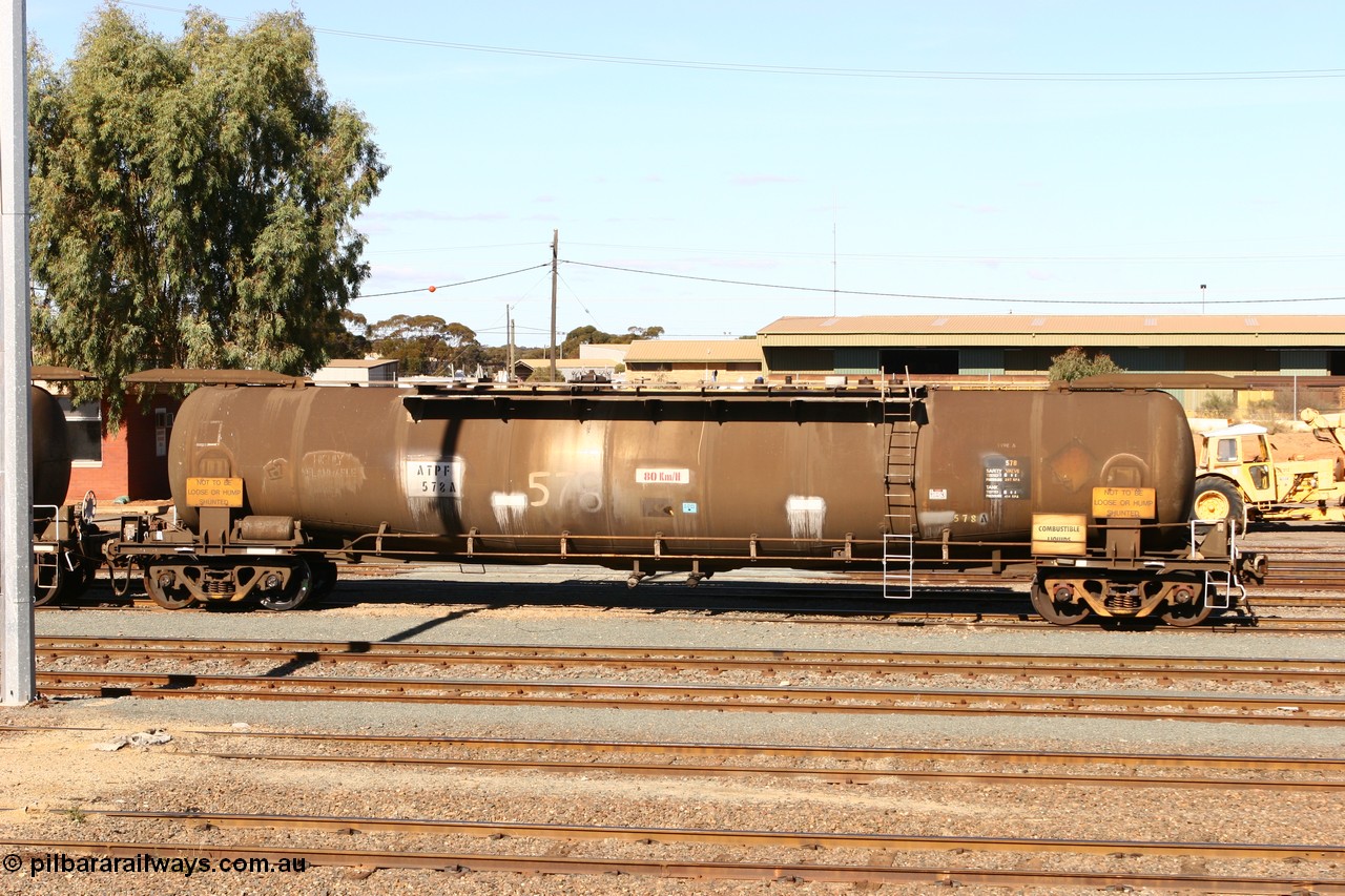 070529 9421
West Kalgoorlie, ATPF 578 fuel tank waggon, originally built by WAGR Midland Workshops in 1974 for Shell as type WJP, it also spent time in SA in 1985, 80.66 kL one compartment one dome, capacity of 80350 litres, fitted with type F InterLock couplers.
Keywords: ATPF-type;ATPF578;WAGR-Midland-WS;WJP-type;