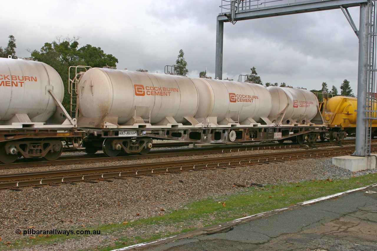 070608 0093
Midland, AQCY 30212 container waggon, originally one of forty five built by WAGR Midland Workshops in 1974 as WFX type, to WQCX in 1981, carrying three Cockburn Cement pressurised cement - lime tanktainers.
Keywords: AQCY-type;AQCY30212;WAGR-Midland-WS;WFX-type;WQCX-type;