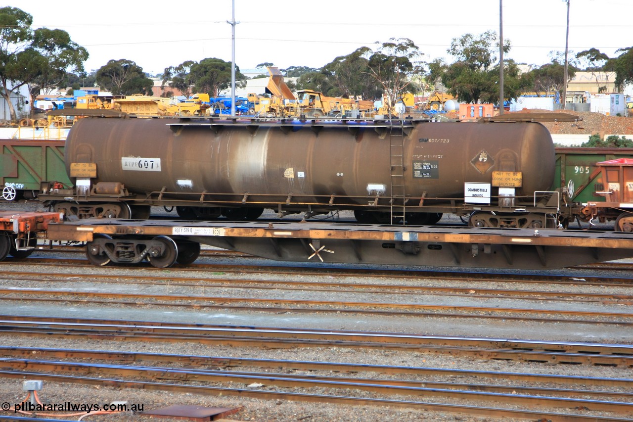 100601 8426
West Kalgoorlie, ATPF 607 fuel tank waggon, built by Westrail Midland Workshops 1982 for Shell as WJP type, 80.66 kL one compartment one dome, fitted with type F InterLock couplers.
Keywords: ATPF-type;ATPF607;Westrail-Midland-WS;WJP-type;