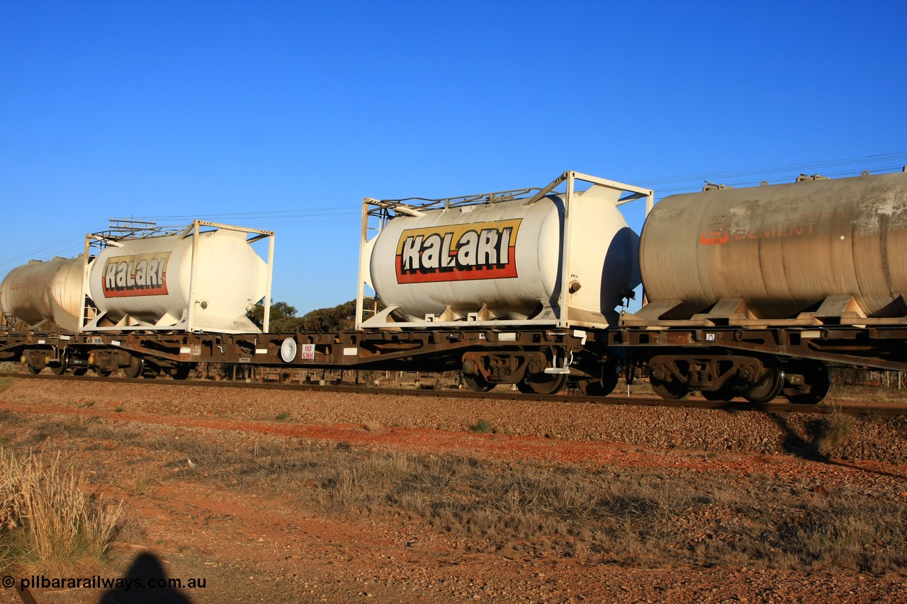 100601 8516
Parkeston, AQWY 30233 flat waggon, one of forty five waggons built by WAGR Midland Workshops in 1974 as WFX type, recoded in 1981 to WQCX, recoded to AQCY under ARG ownership, loaded with two empty Kalari 20' Jamieson built cement tanktainers.
Keywords: AQWY-type;AQWY30233;WAGR-Midland-WS;WFX-type;WQCX-type;