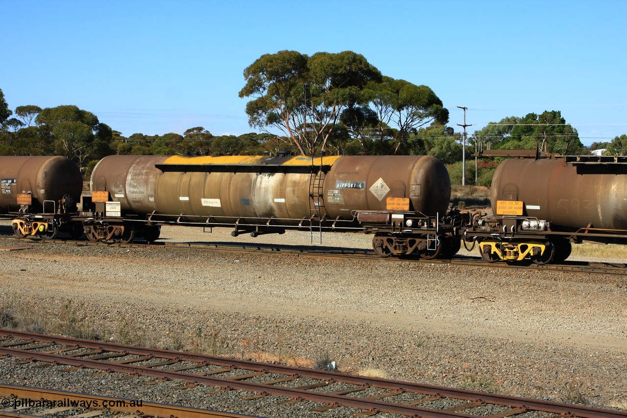100602 8598
West Kalgoorlie, diesel fuel tank waggon ATPY 587 built by Westrail Midland Workshops in 1978 for Mobil, later sold to BP, as type WJP then recoded to WJPY, 80.66 kL one compartment one dome, original code and fleet no. visible, with a capacity now of 80000 litres.
Keywords: ATPY-type;ATPY587;WAGR-Midland-WS;WJP-type;WJPY-type;