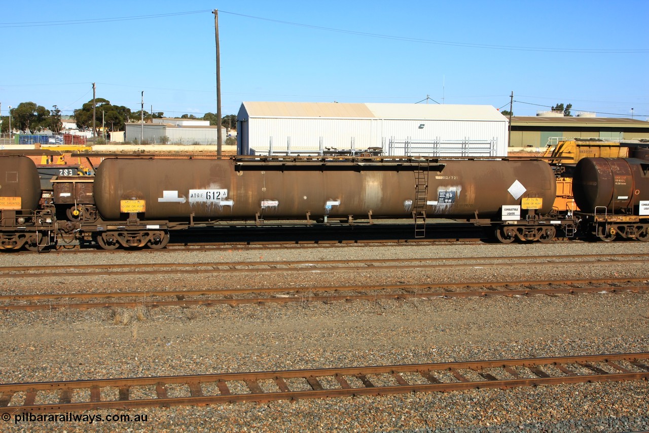 100602 8668
West Kalgoorlie, ATQF 612 diesel fuel tanker, Shell Fleet No. TR721, one of two such waggons built by Indeng Qld in 1982 for Shell as type WJQ with an original capacity of 79000 litres, current diesel capacity of 72000 litres, fitted with type F InterLock couplers.
Keywords: ATQF-type;ATQF612;Indeng-Qld;WJQ-type;