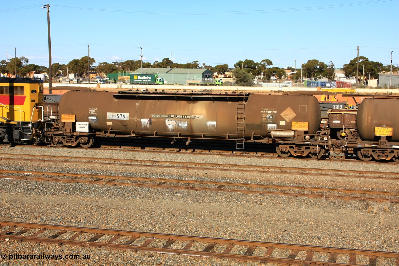 100602 8669
West Kalgoorlie, ATPF 579 fuel tank waggon built by WAGR Midland Workshops 1974 for Shell as WJP type 80.66 kL one compartment one dome, fitted with type F InterLock couplers.
Keywords: ATPF-type;ATPF579;WAGR-Midland-WS;WJP-type;