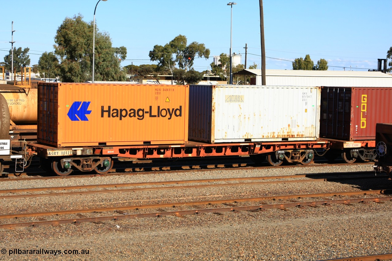 100602 8676
West Kalgoorlie, AQRY 1012, part of a bar coupled pair, ex AFRF type two-pack rail transport waggon, last used on the Darwin line. Loaded with two 20' 22G1 type containers, Hapag-Lloyd HLXU 346611 and Gateway GATU 076734.
Keywords: AQRY-type;AQRY1012;AFRF-type;