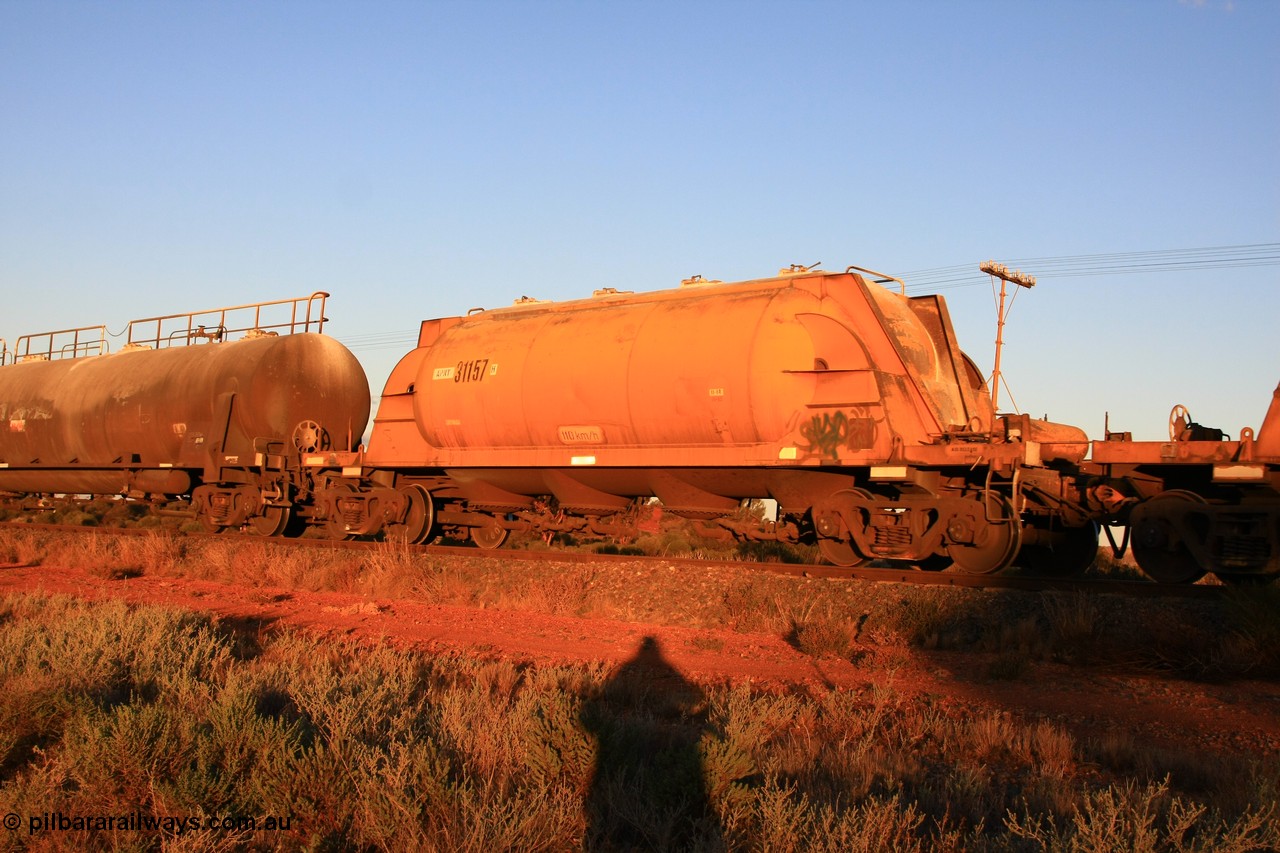 100602 8786
Parkeston, APNY 31157 one of twelve units built by WAGR Midland Workshops in 1974 as WNA type pneumatic discharge nickel concentrate waggon, WAGR built and owned copies of the AE Goodwin built WN waggons for WMC.
Keywords: APNY-type;APNY31157;WAGR-Midland-WS;WNA-type;
