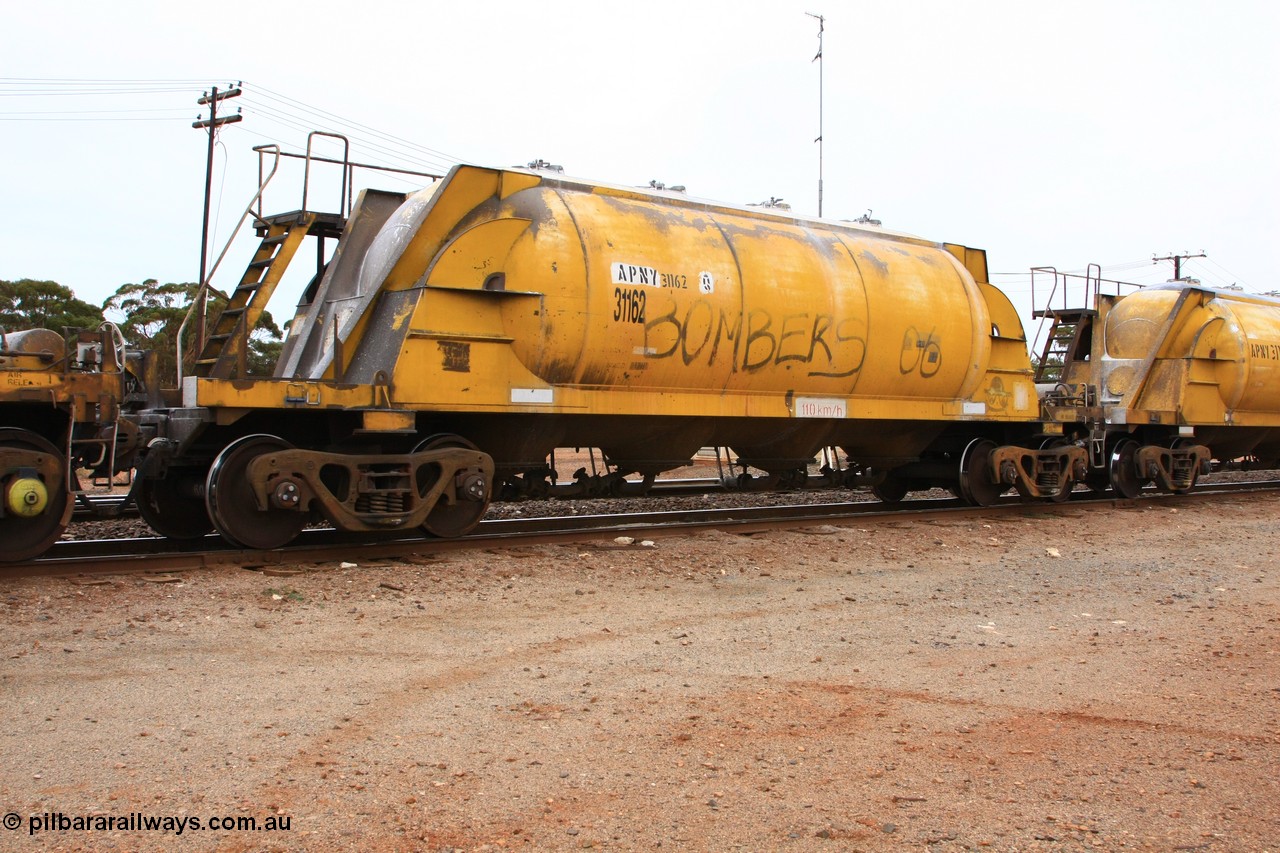 100605 9114
Parkeston, APNY 31162, final one of twelve built by WAGR Midland Workshops in 1974 as WNA type pneumatic discharge nickel concentrate waggon, WAGR built and owned copies of the AE Goodwin built WN waggons for WMC.
Keywords: APNY-type;APNY31162;WAGR-Midland-WS;WNA-type;
