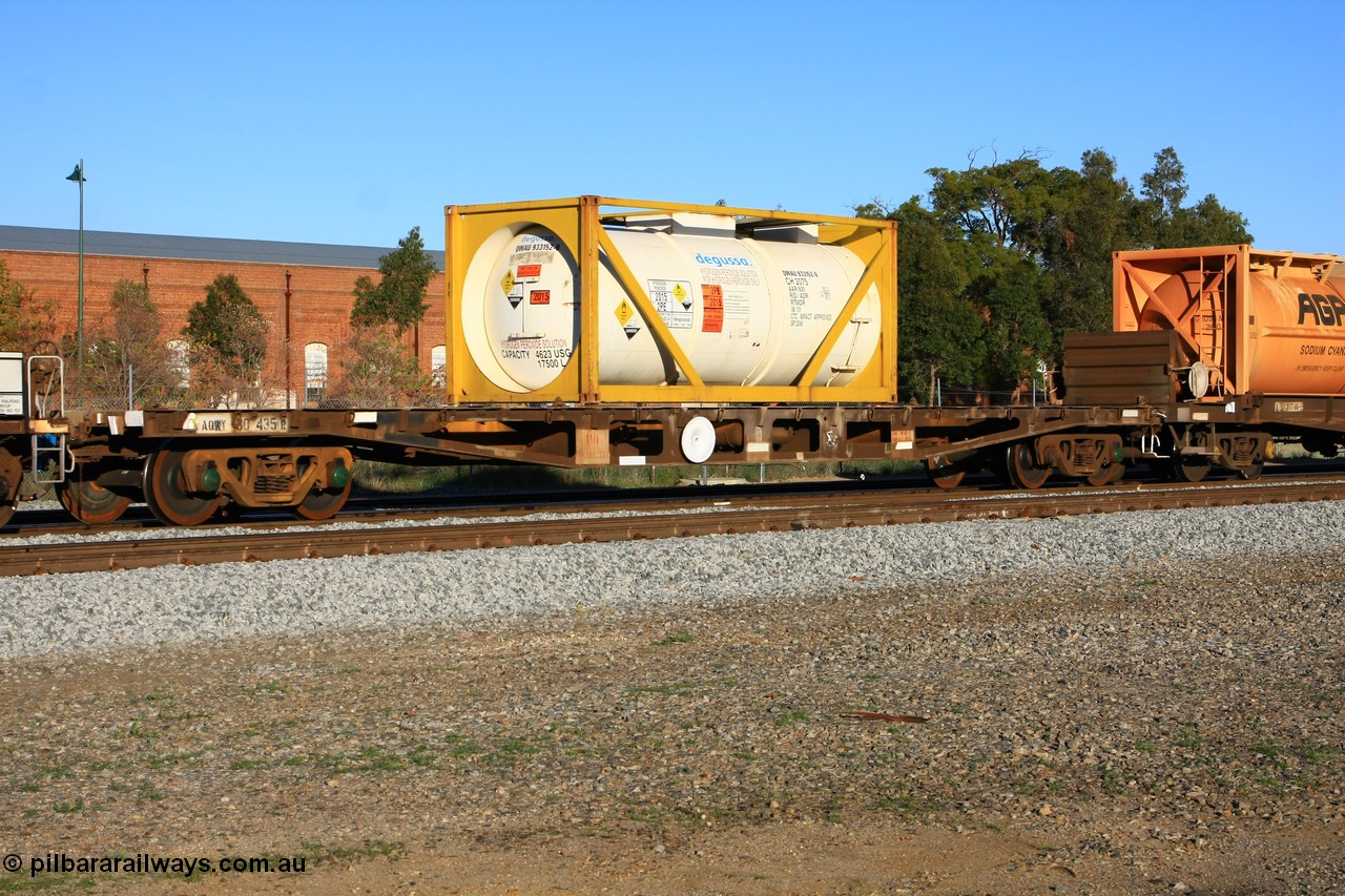100609 09990
Midland, AQWY 30435 container waggon originally one of one hundred and sixty one built by Tomlinson Steel in 1970 as WFX type, to WQCX in 1980. Loaded with a 20' Degussa 2075 type tanktainer DWAU 933152 for hydrogen peroxide.
Keywords: AQWY-type;AQWY30435;Tomlinson-Steel-WA;WFX-type;WQCX-type;