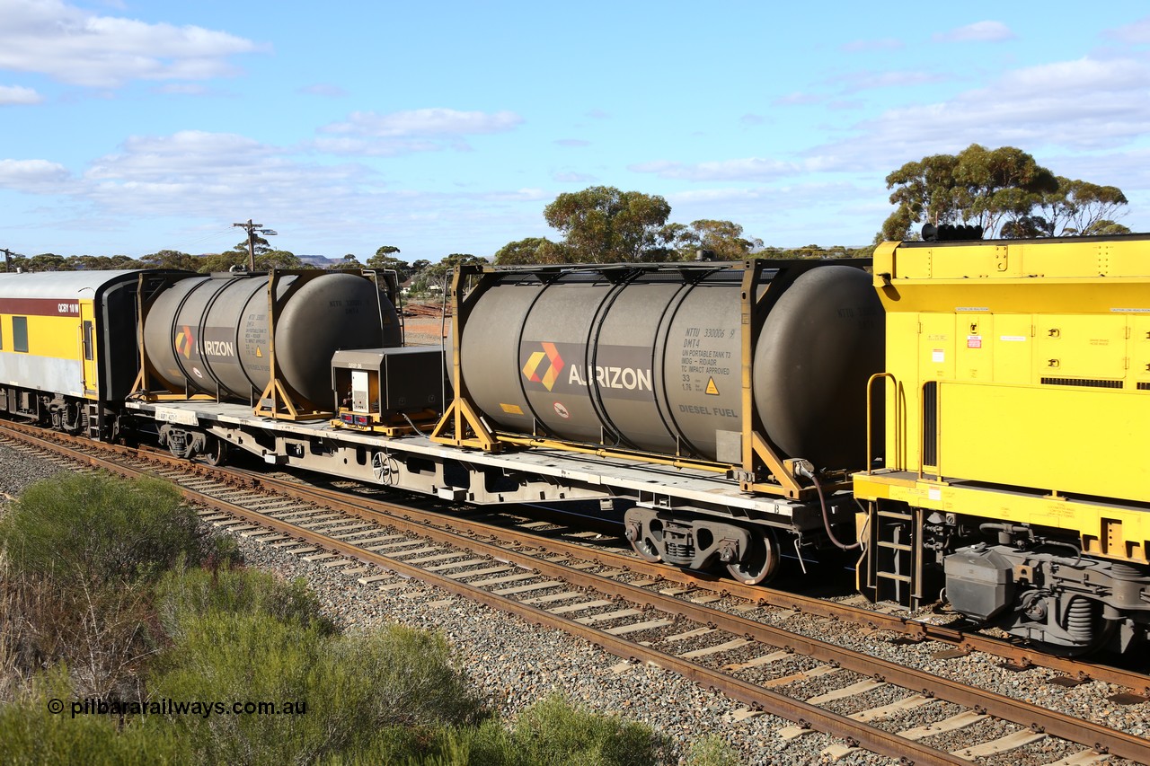 160525 4861
West Kalgoorlie, Aurizon intermodal train 2MP1. Inline fuelling waggon QQFY 4271, originally built for Commonwealth Railways in 1976 by Perry Engineering SA as type RMX, recoded to AQMX, 70 tonne bogies became AQMY, then RQMY, to QR National in 2007. Seen here with two 30' diesel fuel tanktainers from Nantong Tank Container Company, NTTU 330006[9] and NTTU 330001[1] each with a 30800 litre capacity, and fuel transfer or pump unit QRIP 06.
Keywords: QQFY-type;QQFY4271;Perry-Engineering-SA;RMX-type;AQMX-type;AQMY-type;RQMY-type;
