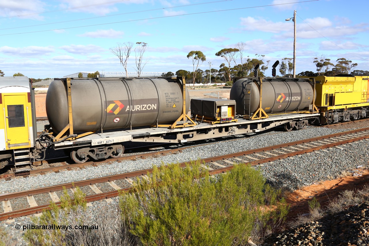 160525 4951
West Kalgoorlie, Aurizon intermodal train 2MP1. Inline fuelling waggon QQFY 4271, originally built for Commonwealth Railways in 1976 by Perry Engineering SA as type RMX, recoded to AQMX, 70 tonne bogies became AQMY, then RQMY, to QR National in 2007. Seen here with two 30' diesel fuel tanktainers from Nantong Tank Container Company, NTTU 330006 and NTTU 330001 each with a 30800 litre capacity, and fuel transfer or pump unit QRIP 06.
Keywords: QQFY-type;QQFY4271;Perry-Engineering-SA;RMX-type;AQMX-type;AQMY-type;RQMY-type;