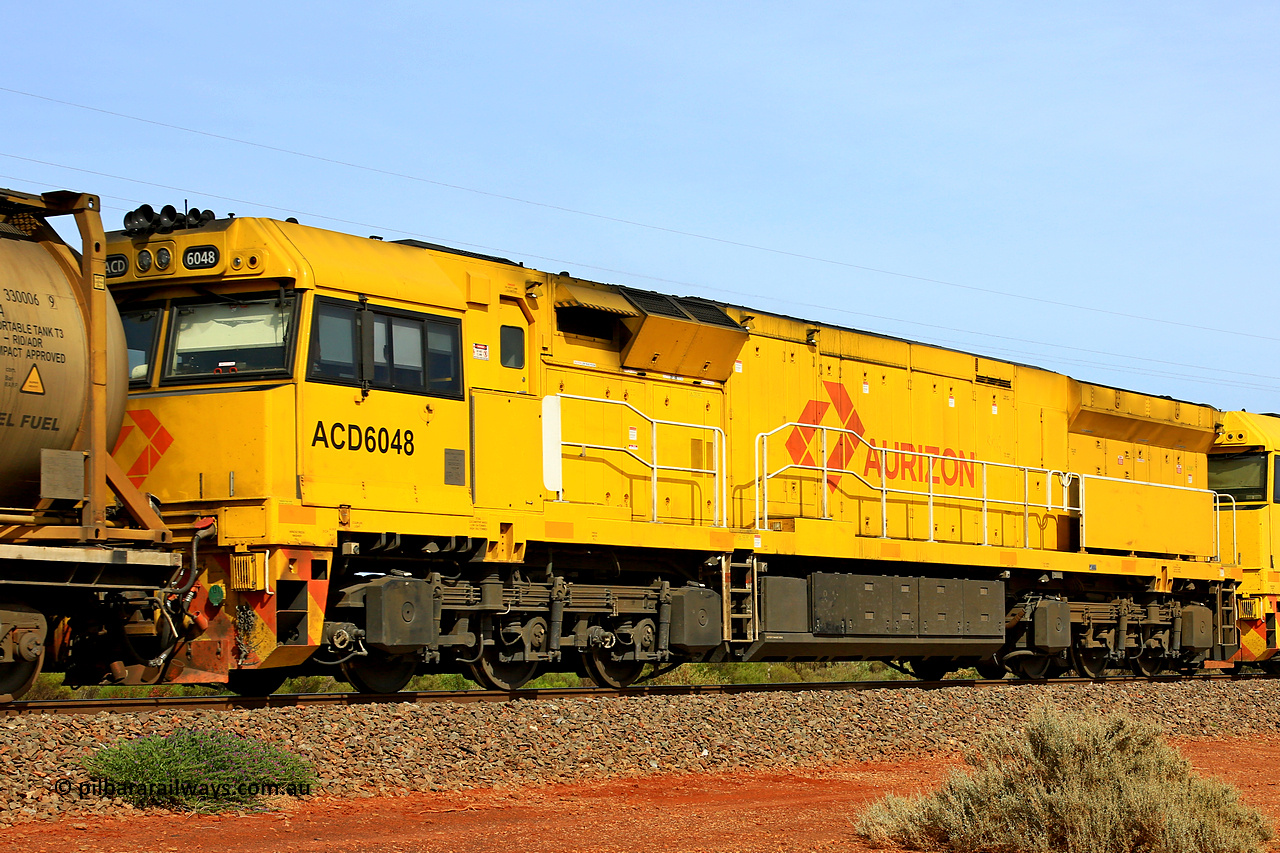 231020 8142
Parkeston, ACD class locomotive ACD 6048 built by Goninan NSW as a GE C44ACi model in April 2022, trails on 4UP1 along the mainline at Parkeston enroute to Kwinana, 20th of October 2023.
Keywords: ACD-class;ACD6048;Goninan-NSW;GE;C44ACi;