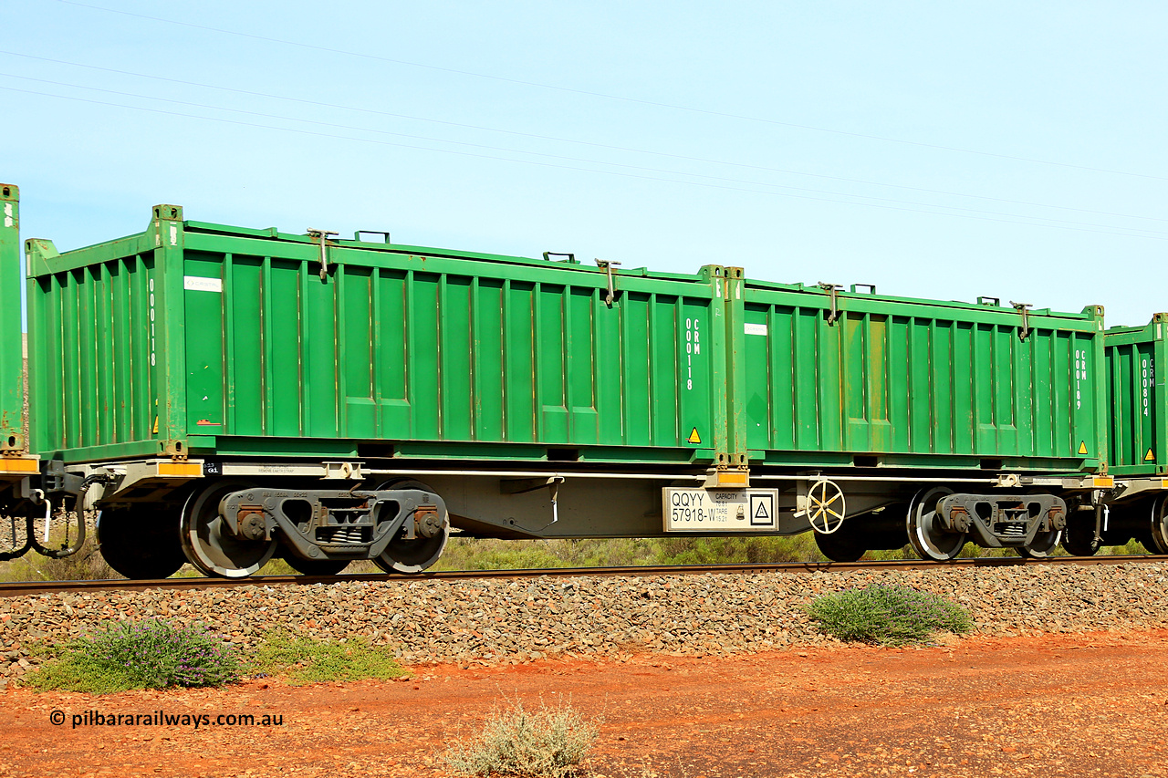 231020 8156
Parkeston, QQYY type 40' container waggon QQYY 57918 one of five hundred ordered by Aurizon and built by CRRC Yangtze Group of China in 2022. In service with two loaded 20' half height hard top 'rotainers' lettered CRM, for Cristal Mining before they were absorbed into Tronox, CRM 000189 with Cristal decal and CRM 000118 with Cristal decal, on Aurizon's Tronox mineral sands train 4UP1 from Ivanhoe / Broken Hill (NSW) to Kwinana (WA). 20th of October 2023.
Keywords: QQYY-type;QQYY57918;CRRC-Yangtze-Group-China;