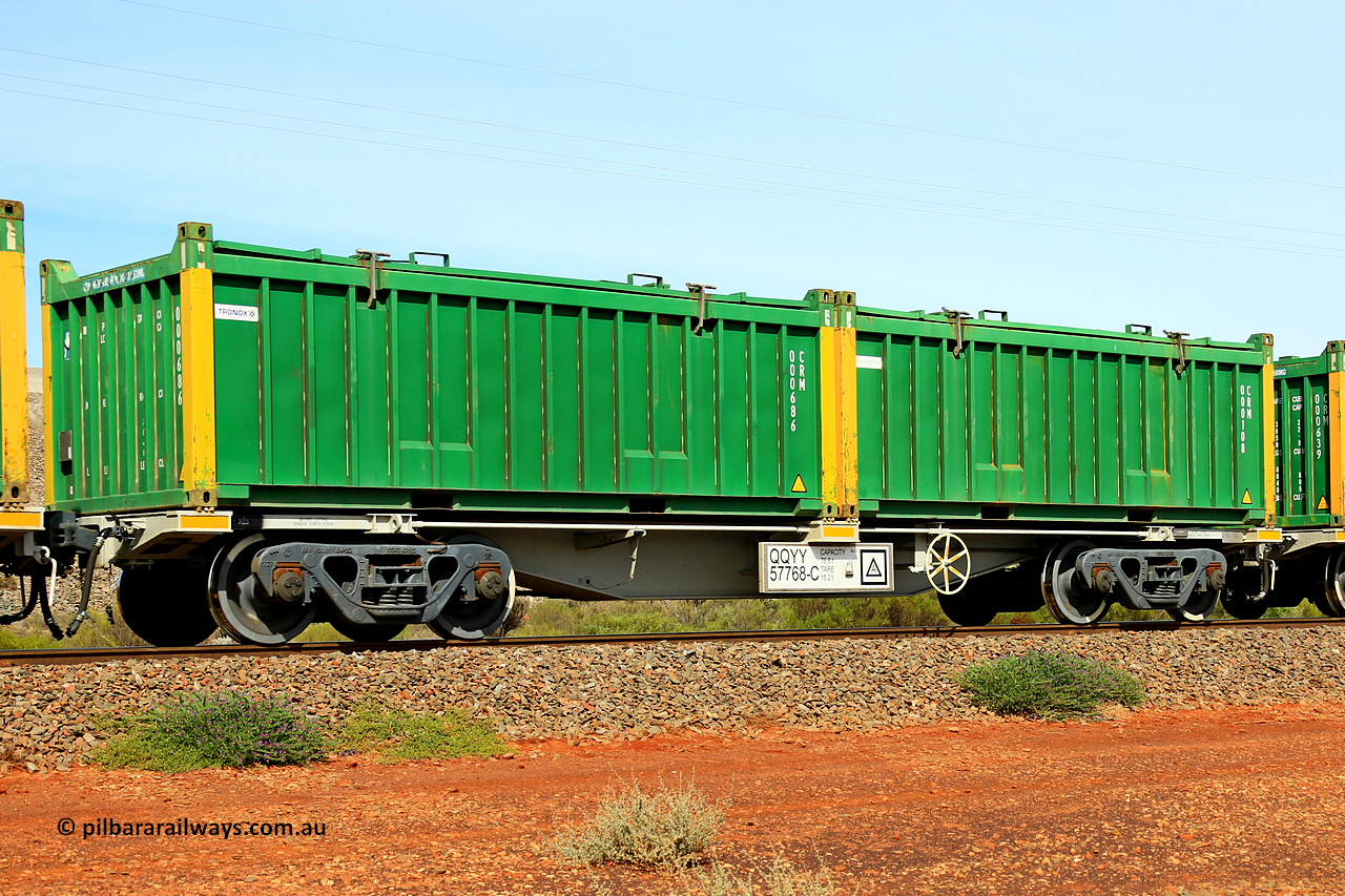 231020 8170
Parkeston, QQYY type 40' container waggon QQYY 57768 one of five hundred ordered by Aurizon and built by CRRC Yangtze Group of China in 2022. In service with two loaded 20' half height hard top 'rotainers' lettered CRM, for Cristal Mining before they were absorbed into Tronox, CRM 000108 with Cristal decal and yellow corner posts and CRM 000686 with Tronox decal and yellow corner posts, on Aurizon's Tronox mineral sands train 4UP1 from Ivanhoe / Broken Hill (NSW) to Kwinana (WA). 20th of October 2023.
Keywords: QQYY-type;QQYY57768;CRRC-Yangtze-Group-China;
