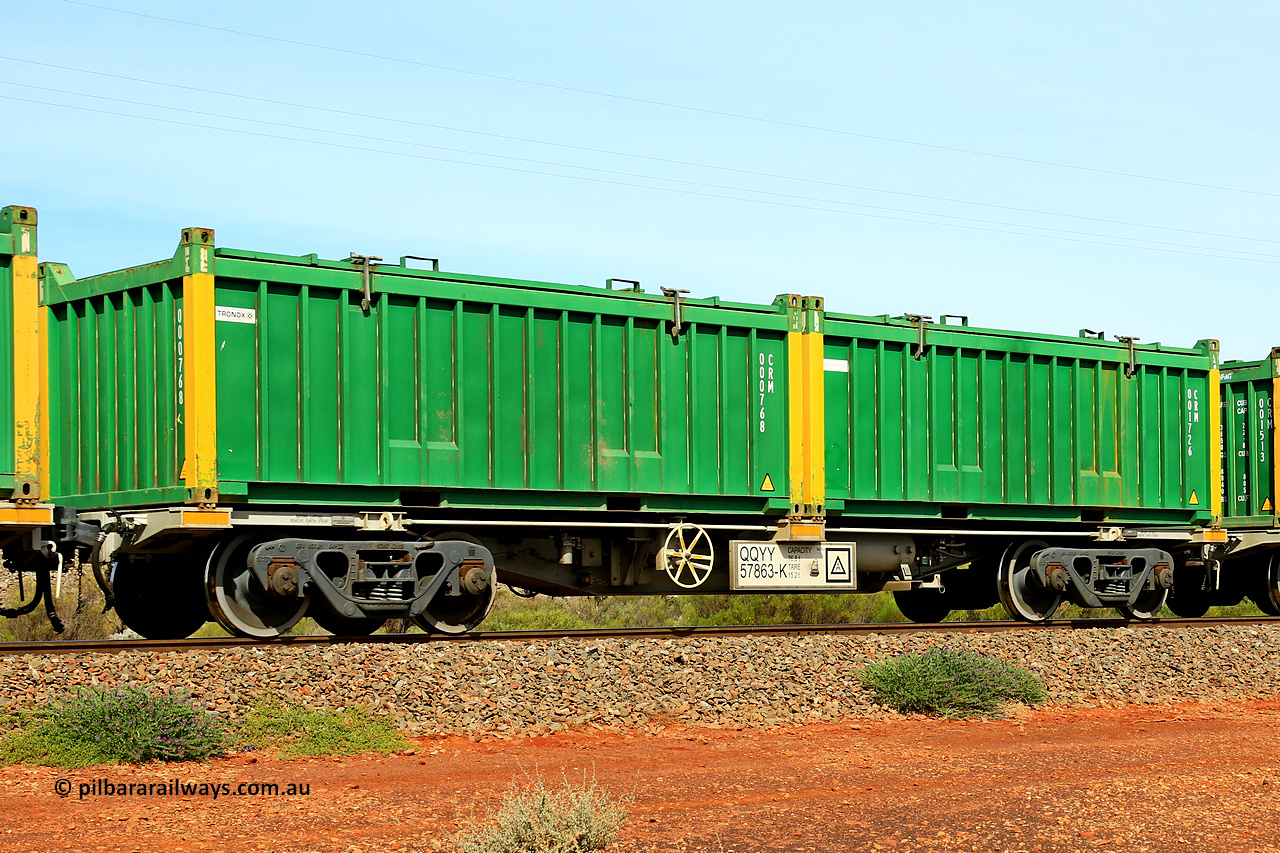231020 8211
Parkeston, QQYY type 40' container waggon QQYY 57863 one of five hundred ordered by Aurizon and built by CRRC Yangtze Group of China in 2022. In service with two loaded 20' half height hard top 'rotainers' lettered CRM, for Cristal Mining before they were absorbed into Tronox, CRM 001726 with Cristal decal and yellow corner posts and CRM 000768 with Tronox decal and yellow corner posts, on Aurizon's Tronox mineral sands train 4UP1 from Ivanhoe / Broken Hill (NSW) to Kwinana (WA). 20th of October 2023.
Keywords: QQYY-type;QQYY57863;CRRC-Yangtze-Group-China;