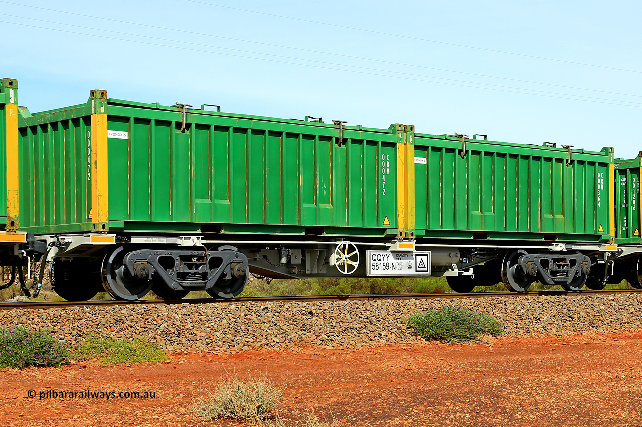 231020 8221
Parkeston, QQYY type 40' container waggon QQYY 58159 one of five hundred ordered by Aurizon and built by CRRC Yangtze Group of China in 2022. In service with two loaded 20' half height hard top 'rotainers' lettered CRM, for Cristal Mining before they were absorbed into Tronox, CRM 000364 with Tronox decal and yellow corner posts and CRM 000472 with Tronox decal and yellow corner posts, on Aurizon's Tronox mineral sands train 4UP1 from Ivanhoe / Broken Hill (NSW) to Kwinana (WA). 20th of October 2023.
Keywords: QQYY-type;QQYY58159;CRRC-Yangtze-Group-China;
