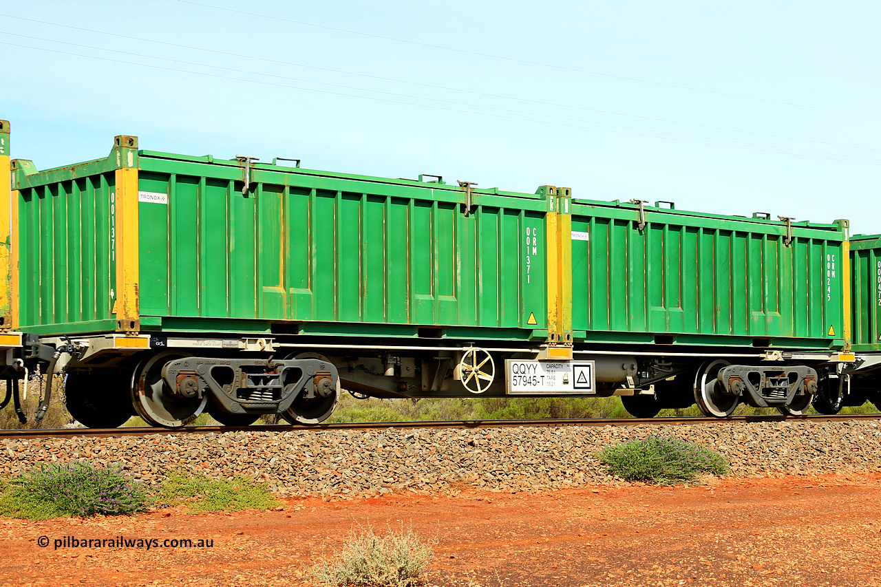 231020 8222
Parkeston, QQYY type 40' container waggon QQYY 57945 one of five hundred ordered by Aurizon and built by CRRC Yangtze Group of China in 2022. In service with two loaded 20' half height hard top 'rotainers' lettered CRM, for Cristal Mining before they were absorbed into Tronox, CRM 000245 with Tronox decal and yellow corner posts and CRM 001371 with Tronox decal and yellow corner posts, on Aurizon's Tronox mineral sands train 4UP1 from Ivanhoe / Broken Hill (NSW) to Kwinana (WA). 20th of October 2023.
Keywords: QQYY-type;QQYY57945;CRRC-Yangtze-Group-China;