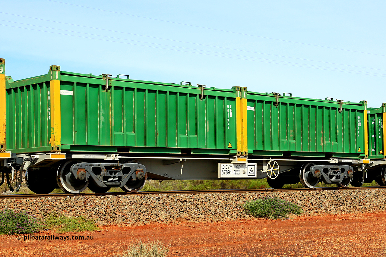 231020 8227
Parkeston, QQYY type 40' container waggon QQYY 57891 one of five hundred ordered by Aurizon and built by CRRC Yangtze Group of China in 2022. In service with two loaded 20' half height hard top 'rotainers' lettered CRM, for Cristal Mining before they were absorbed into Tronox, CRM 000856 with Tronox decal and yellow corner posts and CRM 001659 with Cristal decal and yellow corner posts, on Aurizon's Tronox mineral sands train 4UP1 from Ivanhoe / Broken Hill (NSW) to Kwinana (WA). 20th of October 2023.
Keywords: QQYY-type;QQYY57891;CRRC-Yangtze-Group-China;