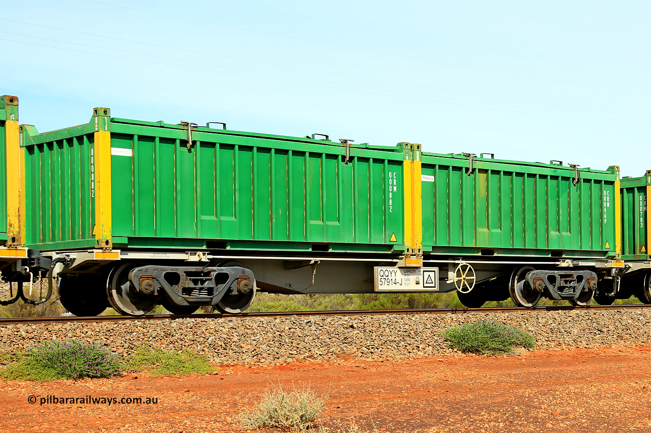 231020 8236
Parkeston, QQYY type 40' container waggon QQYY 57914 one of five hundred ordered by Aurizon and built by CRRC Yangtze Group of China in 2022. In service with two loaded 20' half height hard top 'rotainers' lettered CRM, for Cristal Mining before they were absorbed into Tronox, CRM 000469 with Tronox decal and yellow corner posts and CRM 000882 with Cristal decal and yellow corner posts, on Aurizon's Tronox mineral sands train 4UP1 from Ivanhoe / Broken Hill (NSW) to Kwinana (WA). 20th of October 2023.
Keywords: QQYY-type;QQYY57914;CRRC-Yangtze-Group-China;