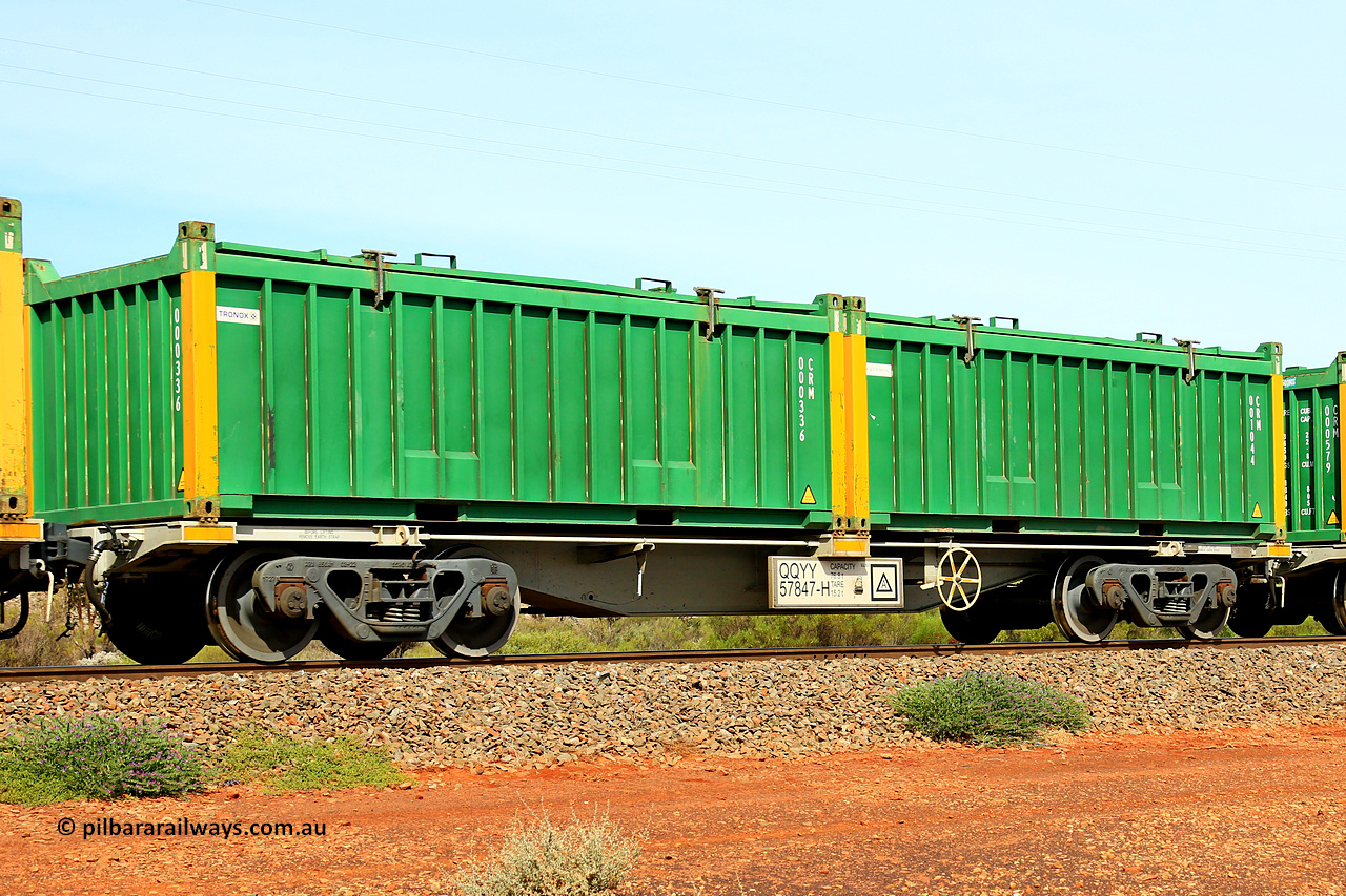 231020 8238
Parkeston, QQYY type 40' container waggon QQYY 57847 one of five hundred ordered by Aurizon and built by CRRC Yangtze Group of China in 2022. In service with two loaded 20' half height hard top 'rotainers' lettered CRM, for Cristal Mining before they were absorbed into Tronox, CRM 001044 with Cristal decal and yellow corner posts and CRM 000336 with Tronox decal and yellow corner posts, on Aurizon's Tronox mineral sands train 4UP1 from Ivanhoe / Broken Hill (NSW) to Kwinana (WA). 20th of October 2023.
Keywords: QQYY-type;QQYY57847;CRRC-Yangtze-Group-China;