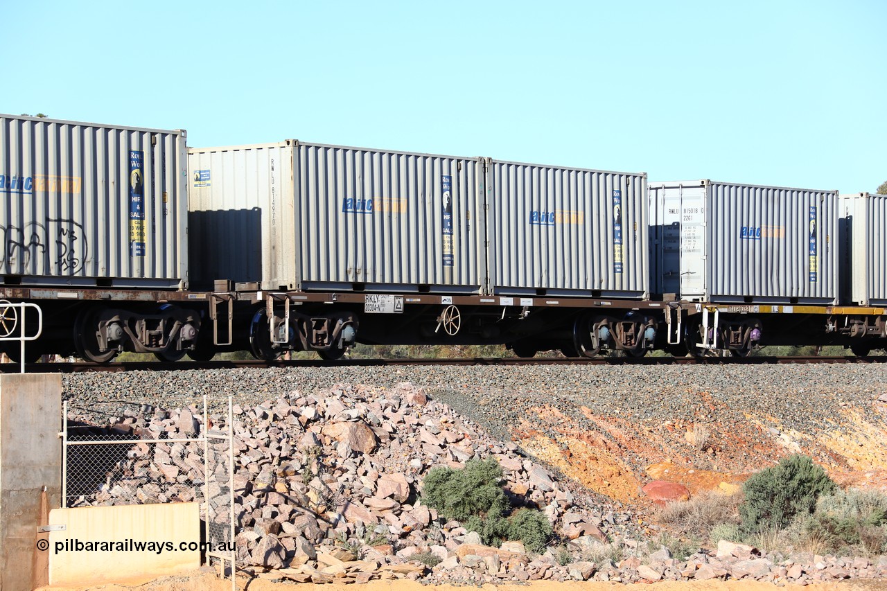 160522 2059
Binduli, 5MP2 steel train, RKLY 20304 container waggon, originally built by EPT NSW in 1979-81 as an BDY / NODY open waggon before being heavily modified by ANI Engineering in 1998, loaded with a pair of 20' 22G1 type Royal Wolf containers with Pacific National decals, RWLU 814970 and RWLU 814877.
Keywords: RKLY-type;RKLY20304;EPT-NSW;BDY-type;NODY-type;