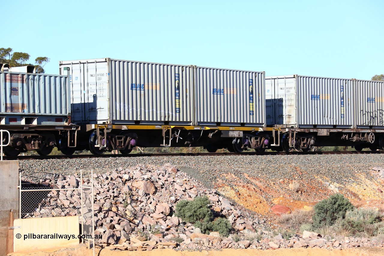 160522 2061
Binduli, 5MP2 steel train, NQYY 20897 container waggon, originally built by EPT NSW in 1980-81 as an BDY / NODY open waggon before being heavily modified with a pair of Royal Wolf 20' 22G1 type containers with Pacific National decals, RWLU 815065 and RWLU 815037.
Keywords: NQYY-type;NQYY20897;EPT-NSW;BDY-type;NODY-type;