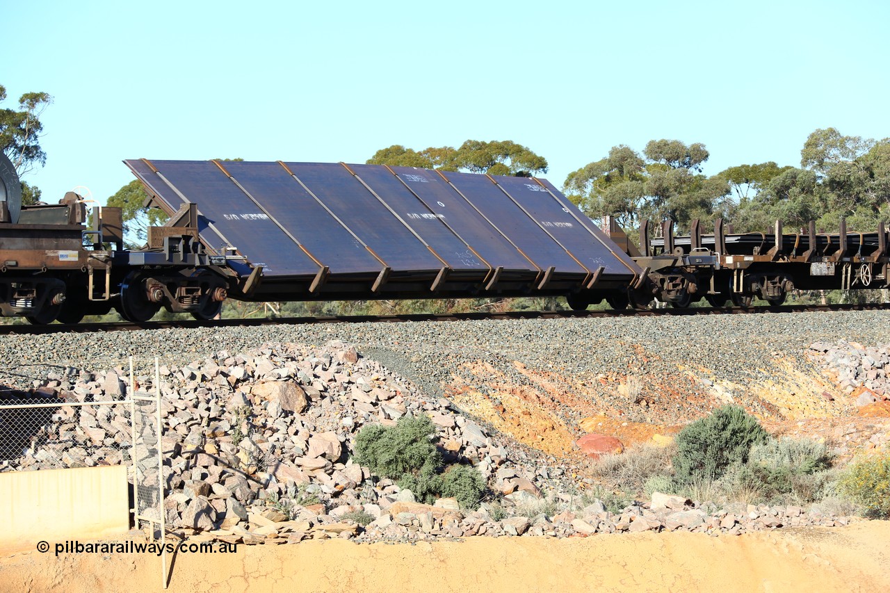 160522 2068
Binduli, 5MP2 steel train, RKVY 8002 wide steel plate tilt waggon, built as part of a batch of five units by Goninan Bassendean WA in 2011, loaded with plates.
Keywords: RKVY-type;RKVY8002;Goninan-WA;