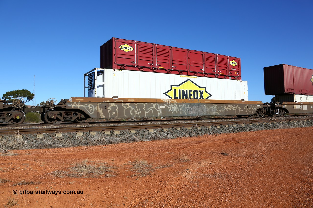 160522 2102
Parkeston, 6MP4 intermodal train, platform 1 of 5-pack RRRY 7014 well waggon set, one of nineteen built in China at Zhuzhou Rolling Stock Works for Goninan in 2005, Linfox reefer FCAD 9106136 and half height side door red Linfox LSDU 6940002 container.
Keywords: RRRY-type;RRRY7014;CSR-Zhuzhou-Rolling-Stock-Works-China;