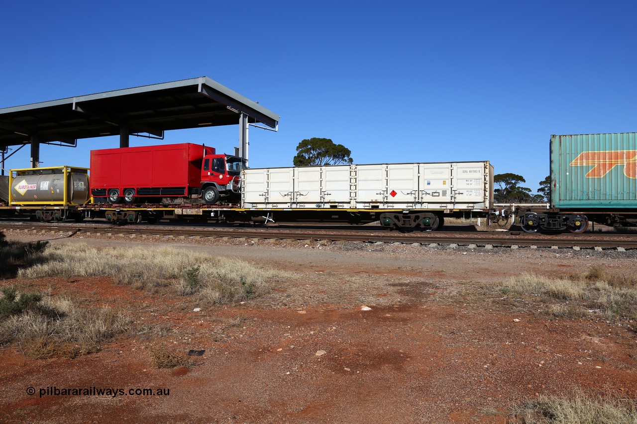 160522 2126
Parkeston, 6MP4 intermodal train, RQJW type container waggon RQJW 21964 built by Mittagong Engineering NSW as part of a batch of twenty five NQJW type waggons in 1981, loaded with half height side door SCF container SCFU 607093 and a flatrack with a Regal Transport truck.
Keywords: RQJW-type;RQJW21964;Mittagong-Engineering-NSW;NQJW-type;
