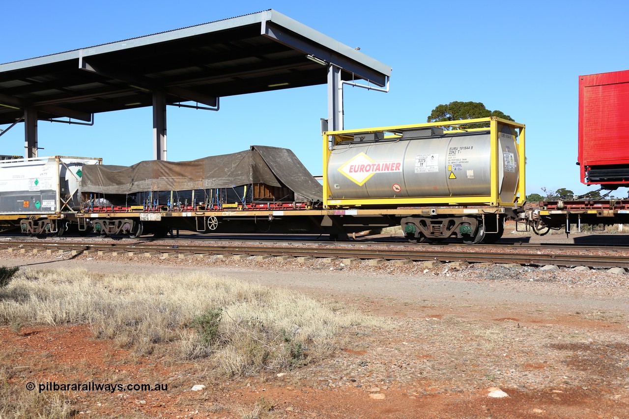 160522 2127
Parkeston, 6MP4 intermodal train, RQAY 21907 container waggon, one of a hundred waggons built in 1981 by EPT NSW as type NQAY, recoded to RQAY in 1994, with CIMC Tank built 20' ISO 22K2 type tanktainer for Eurotainer EURU 191844 with ammonium nitrate emulsion and a K&S 40' flatrack KT 400234 with a tarped load.
Keywords: RQAY-type;RQAY21907;EPT-NSW;NQAY-type;