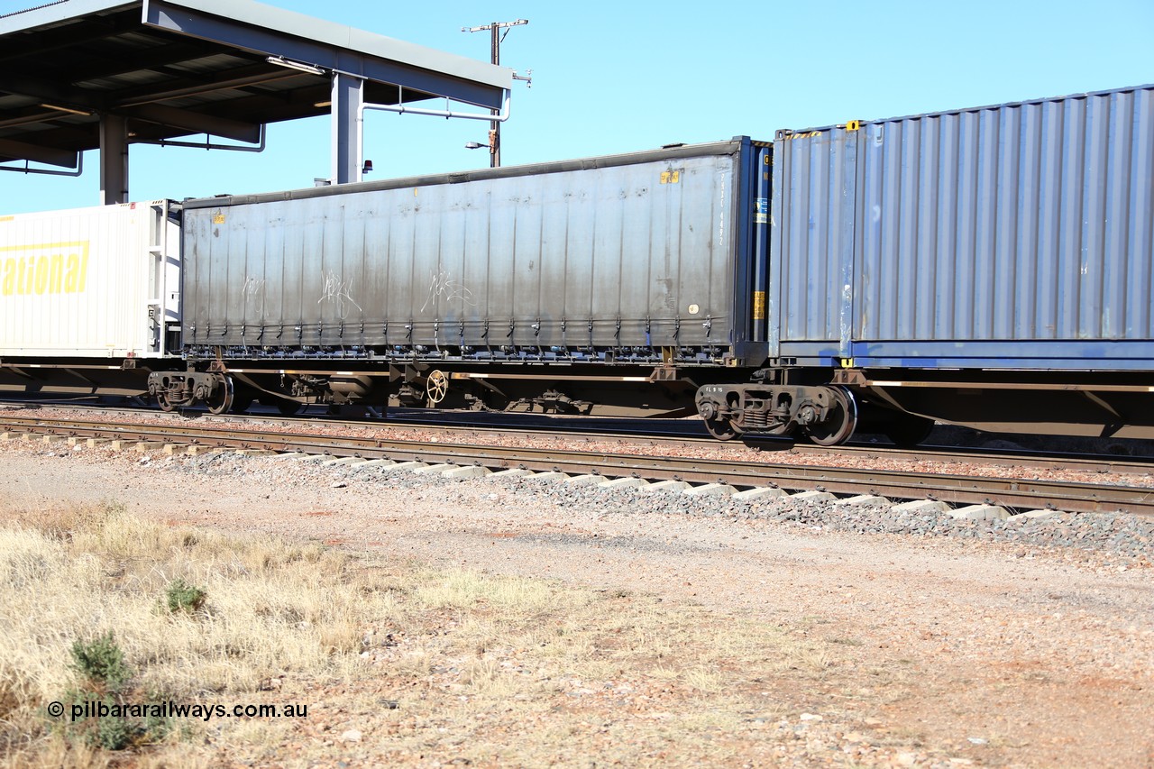 160522 2147
Parkeston, 6MP4 intermodal train, platform 3 of 5 on RRQY 7323 5 pack articulated skel waggon set built by Qiqihar Rollingstock Works China in 2005 for Pacific National, with a curtainsider container of the owner PNXC 4492.
Keywords: RRQY-type;RRQY7323;Qiqihar-Rollingstock-Works-China;